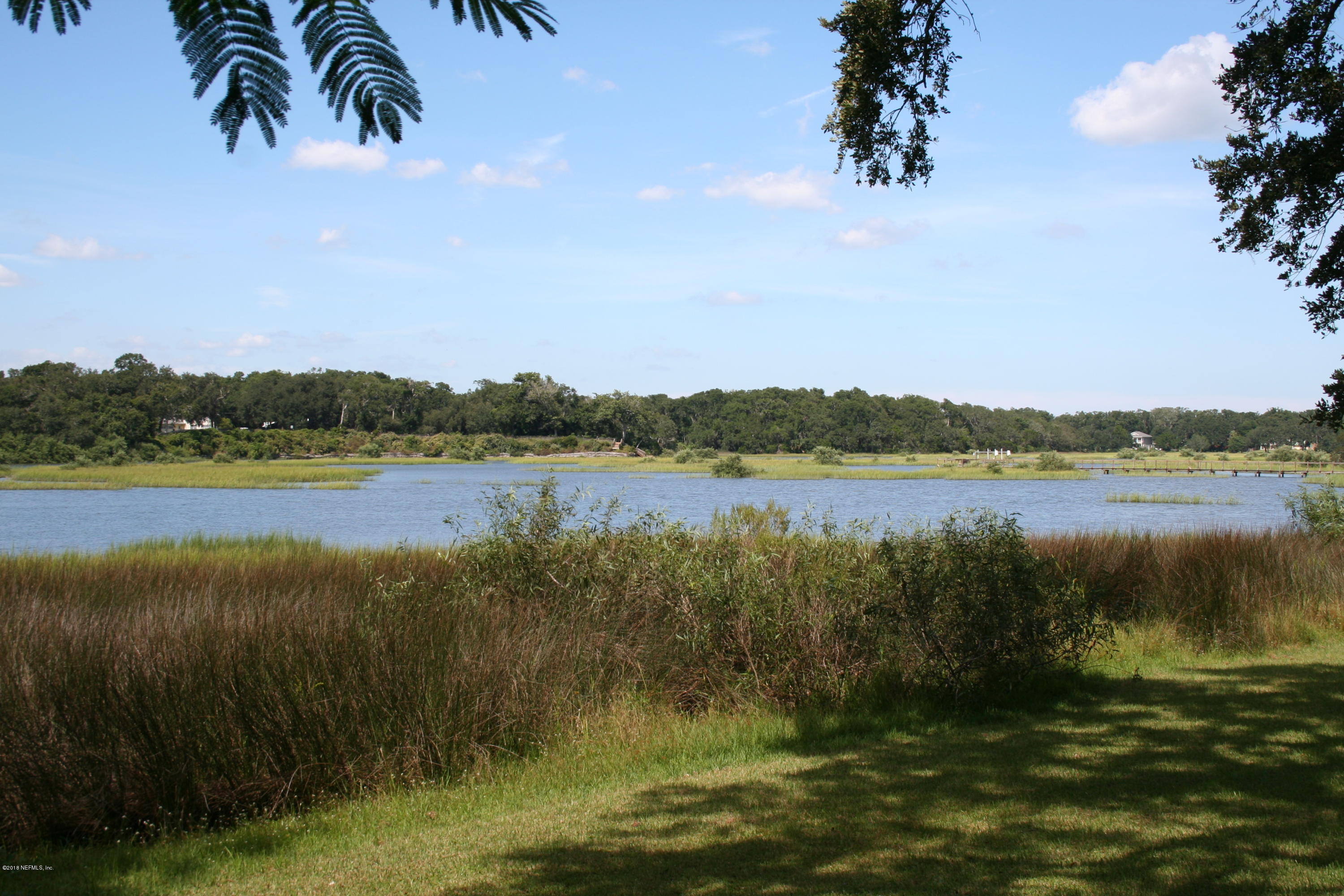 524 Vaill Point Road St. Augustine, FL 32086 - Photo 29 of 50 a view of a lake with houses in background