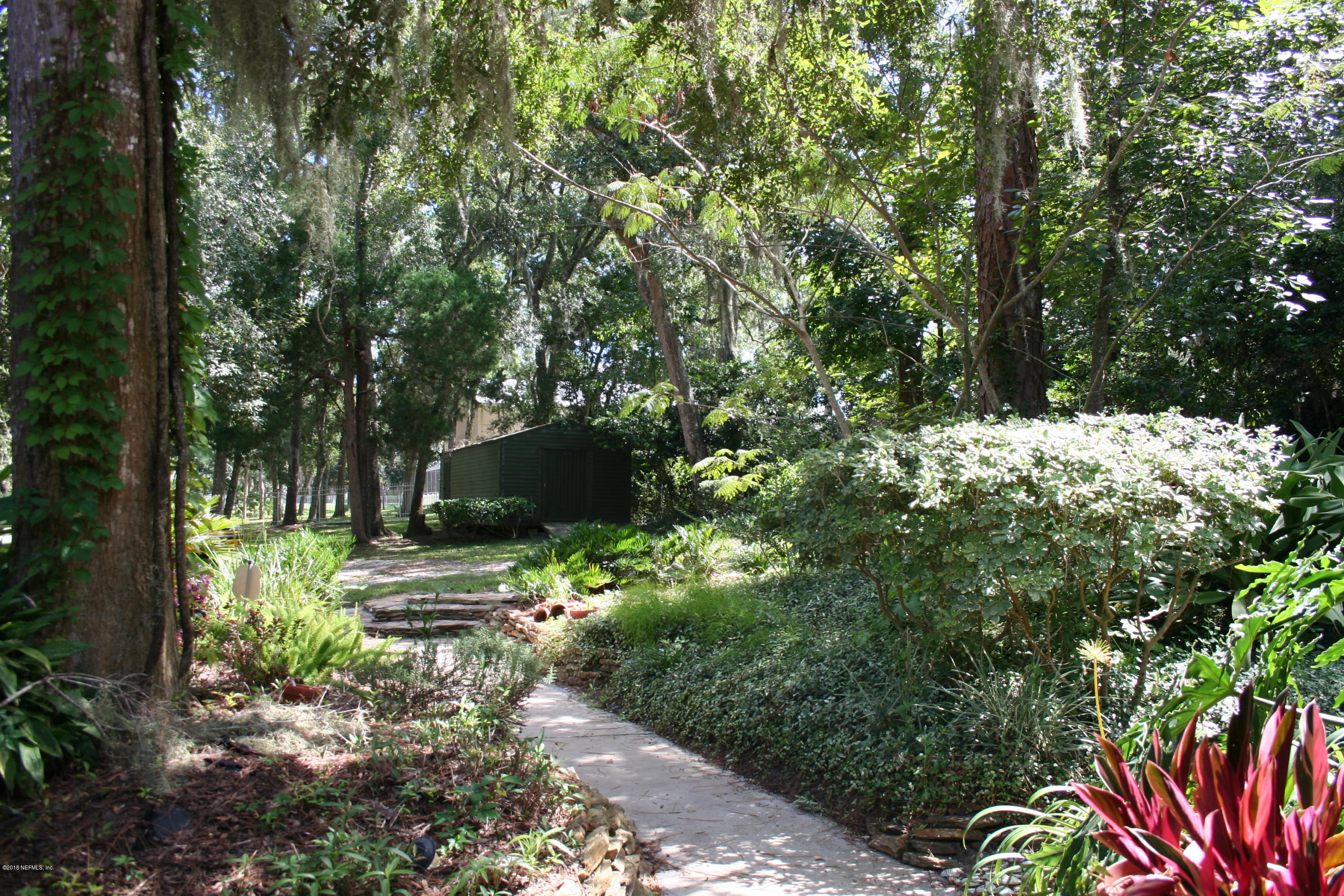 524 Vaill Point Road St. Augustine, FL 32086 - Photo 3 of 50 a backyard of a house with lots of green space