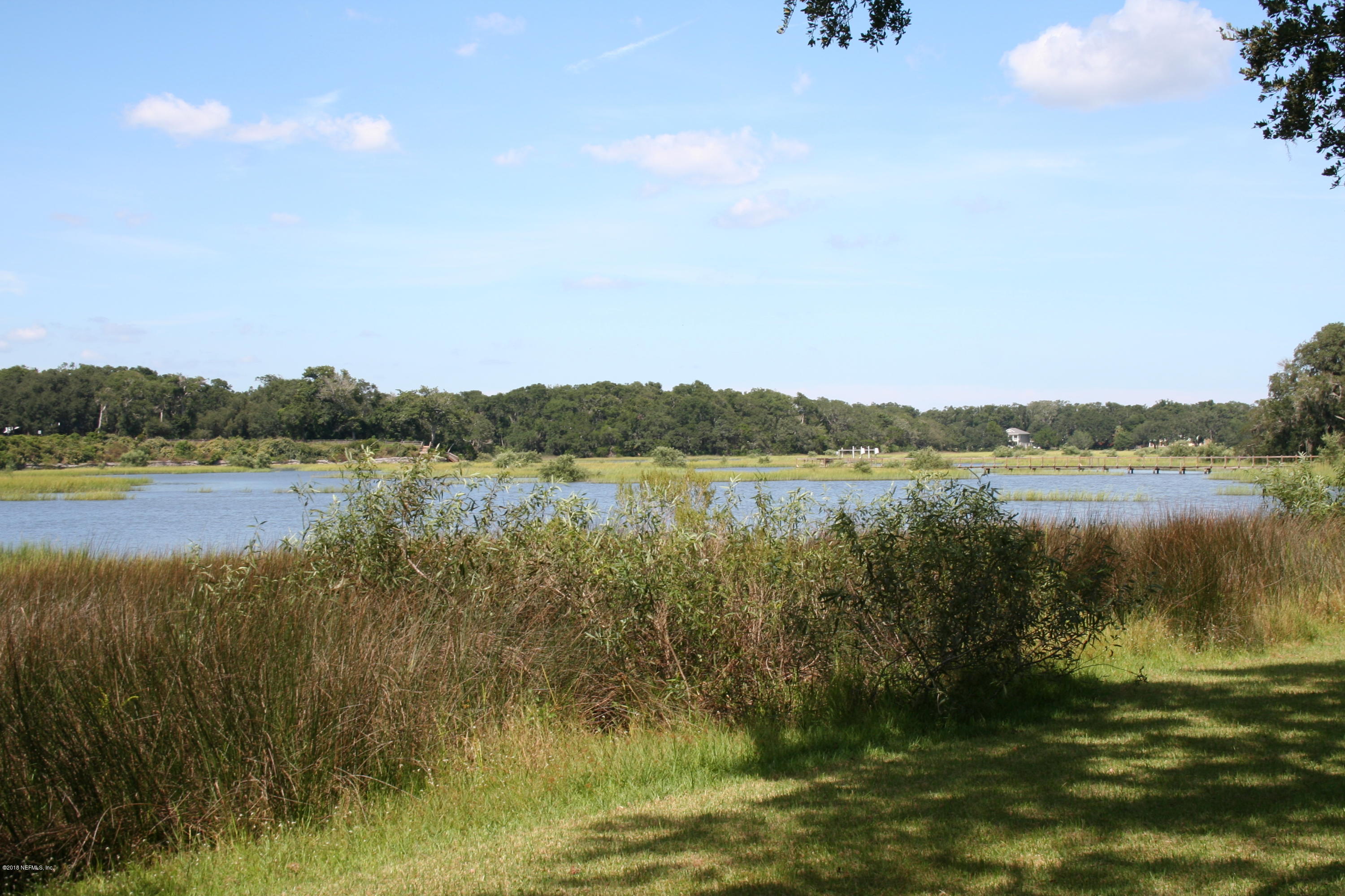 524 Vaill Point Road St. Augustine, FL 32086 - Photo 32 of 50 a view of a lake with houses in the back