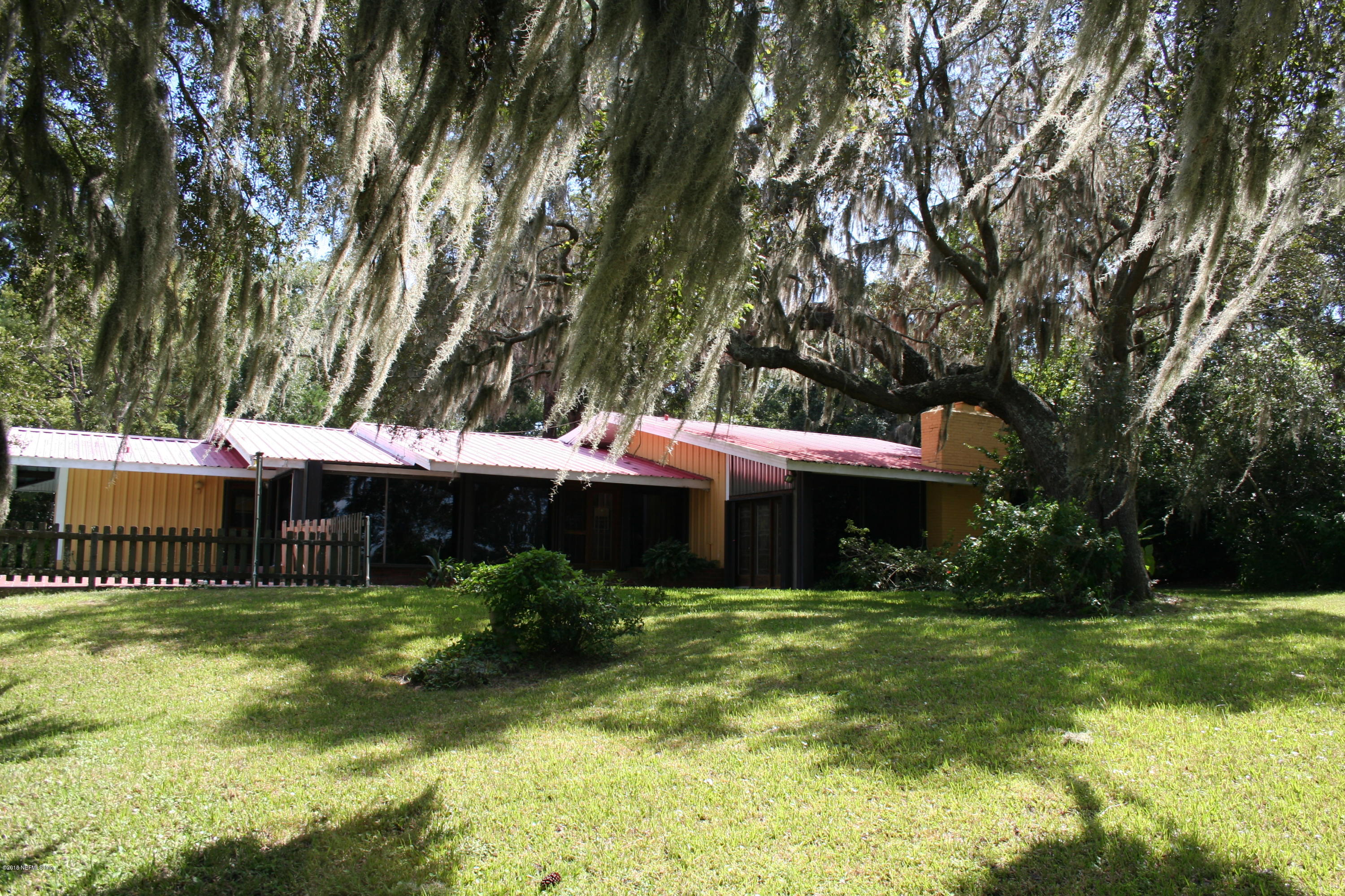 524 Vaill Point Road St. Augustine, FL 32086 - Photo 37 of 50 a front view of a house with garden