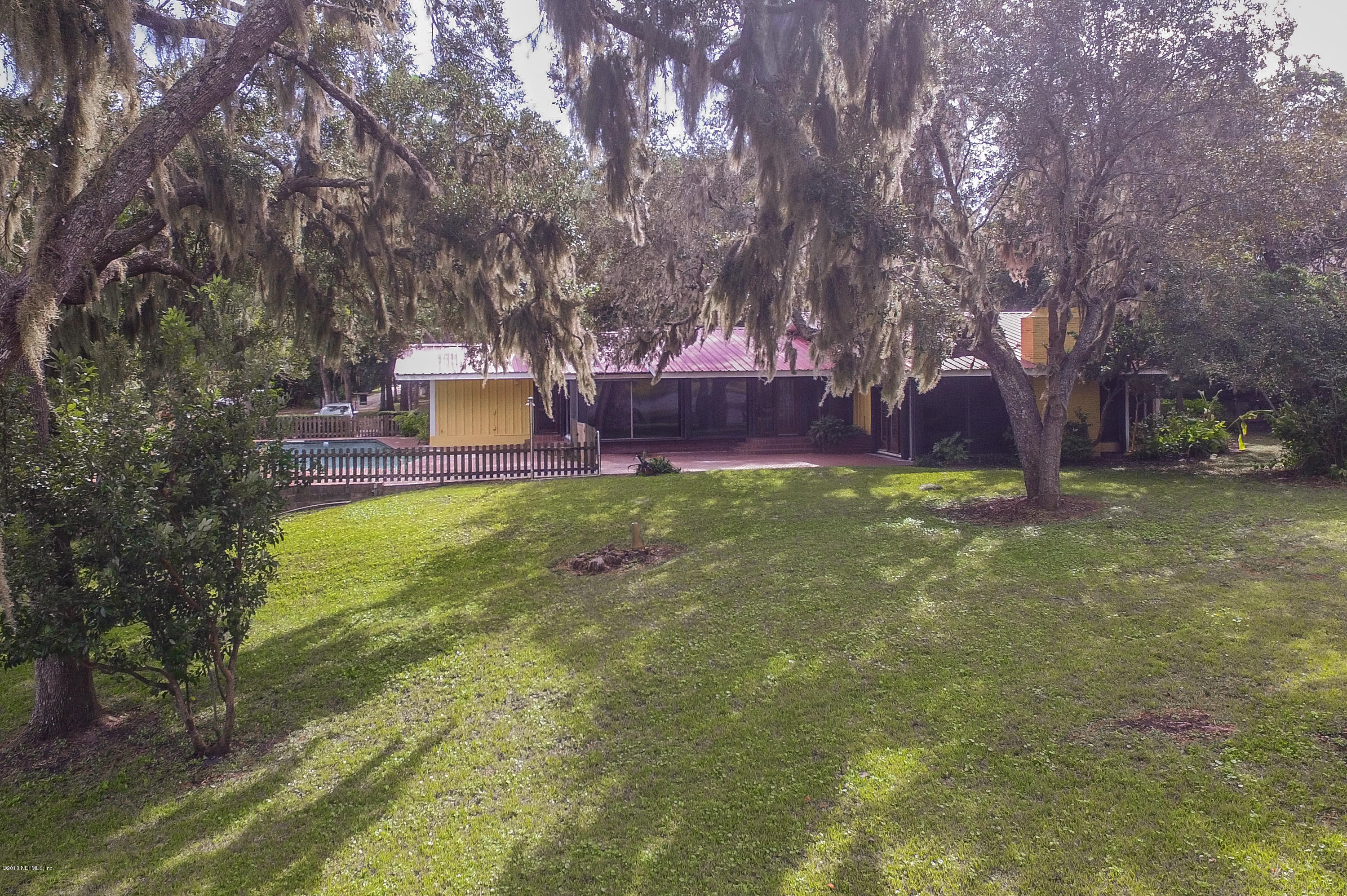 524 Vaill Point Road St. Augustine, FL 32086 - Photo 39 of 50 a view of a yard with a house in the background