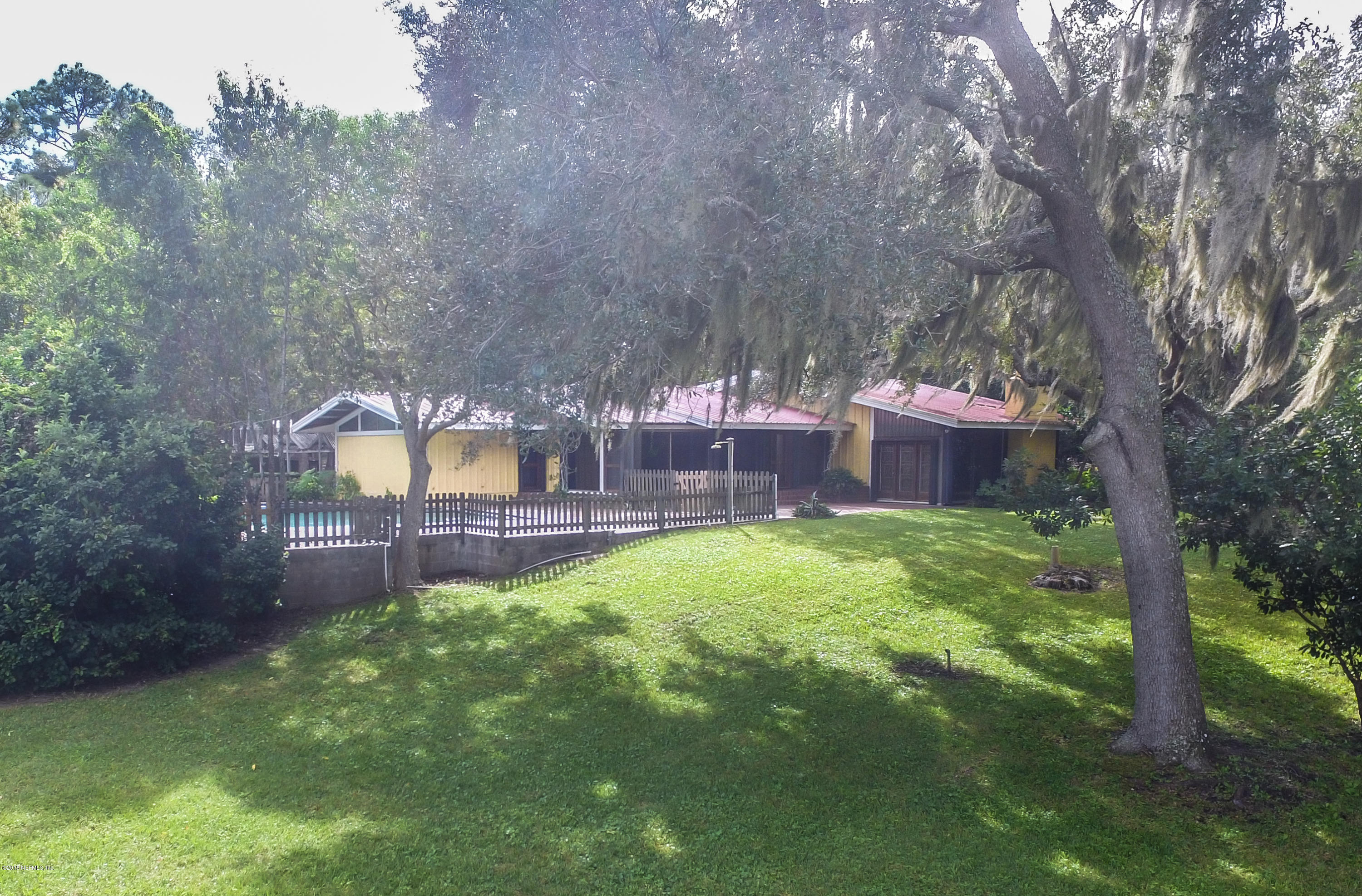 524 Vaill Point Road St. Augustine, FL 32086 - Photo 40 of 50 a view of a backyard with a garden
