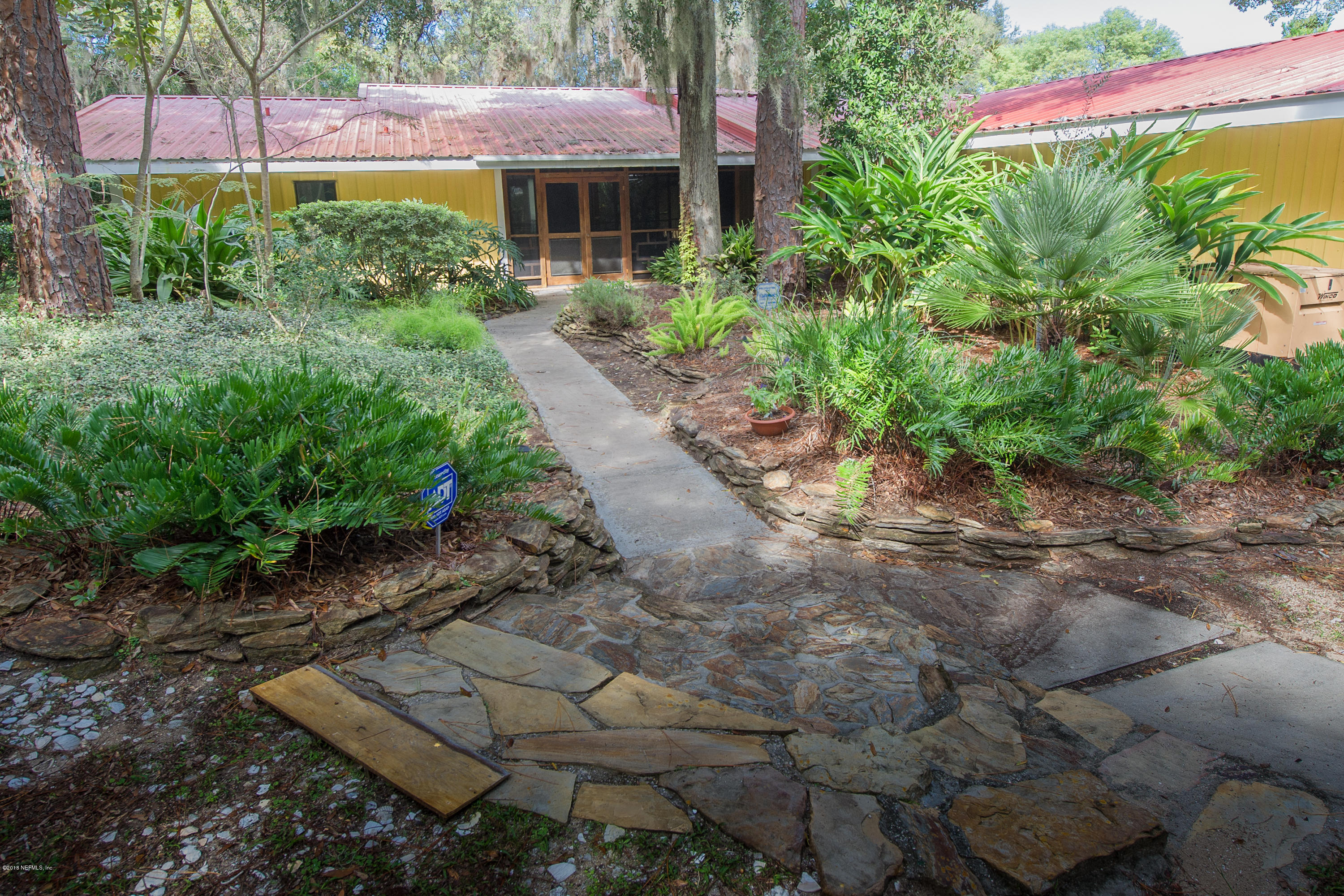 524 Vaill Point Road St. Augustine, FL 32086 - Photo 48 of 50 a backyard of a house with lots of green space