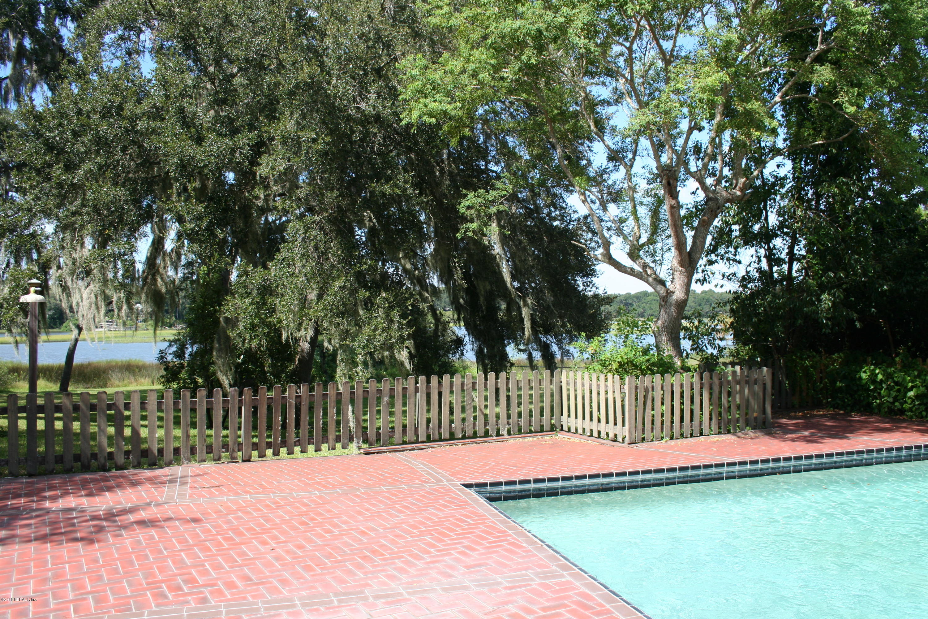 524 Vaill Point Road St. Augustine, FL 32086 - Photo 6 of 50 a view of a swimming pool with a trees