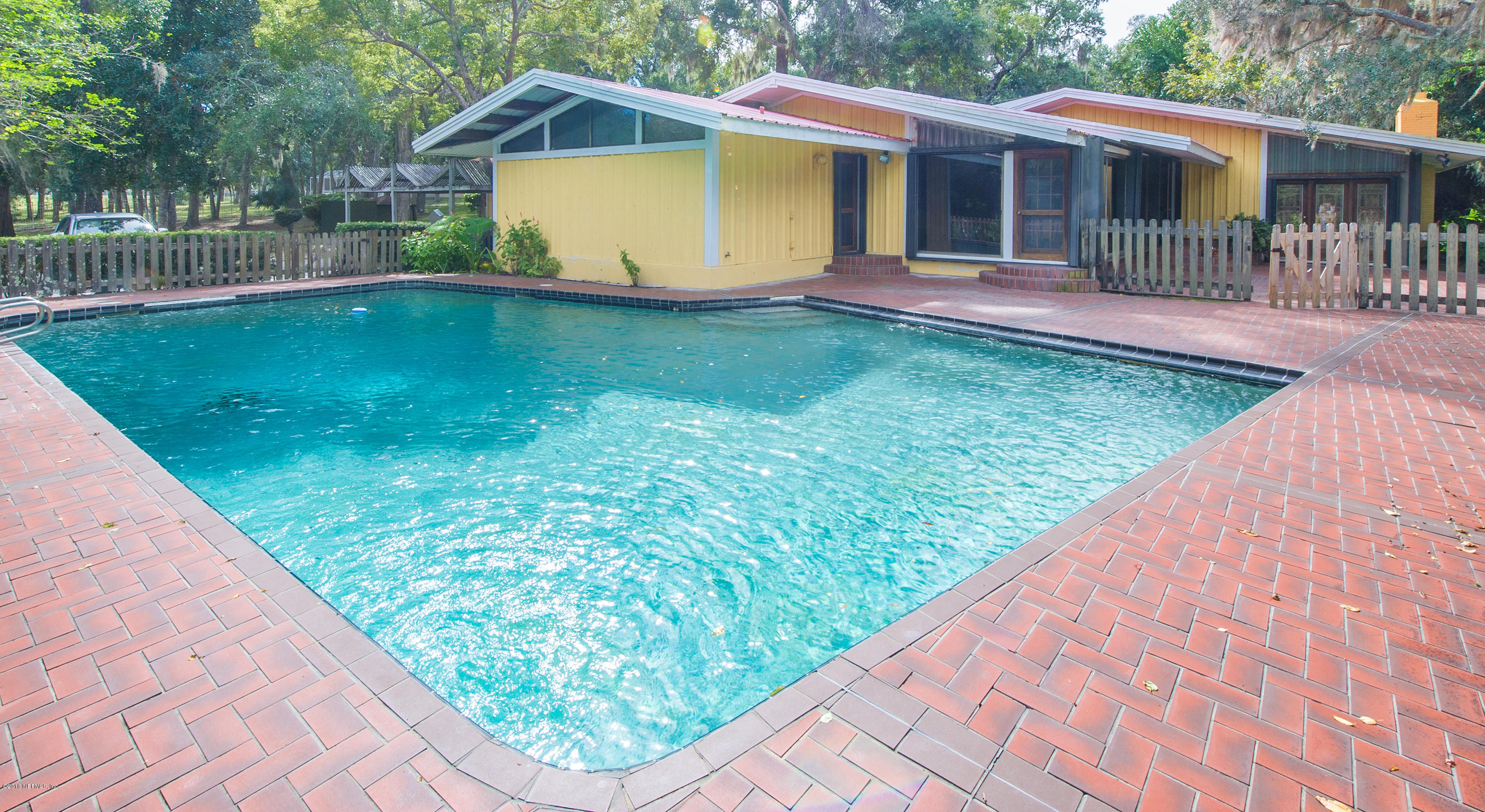 524 Vaill Point Road St. Augustine, FL 32086 - Photo 8 of 50 a view of a house with a backyard and a patio
