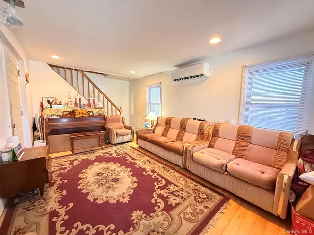 a living room with furniture and a rug