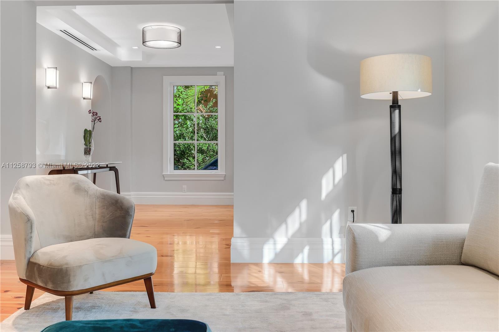 1311 Alhambra Circle Miami, FL 33134 - Photo 11 of 56 a living room with furniture and a window