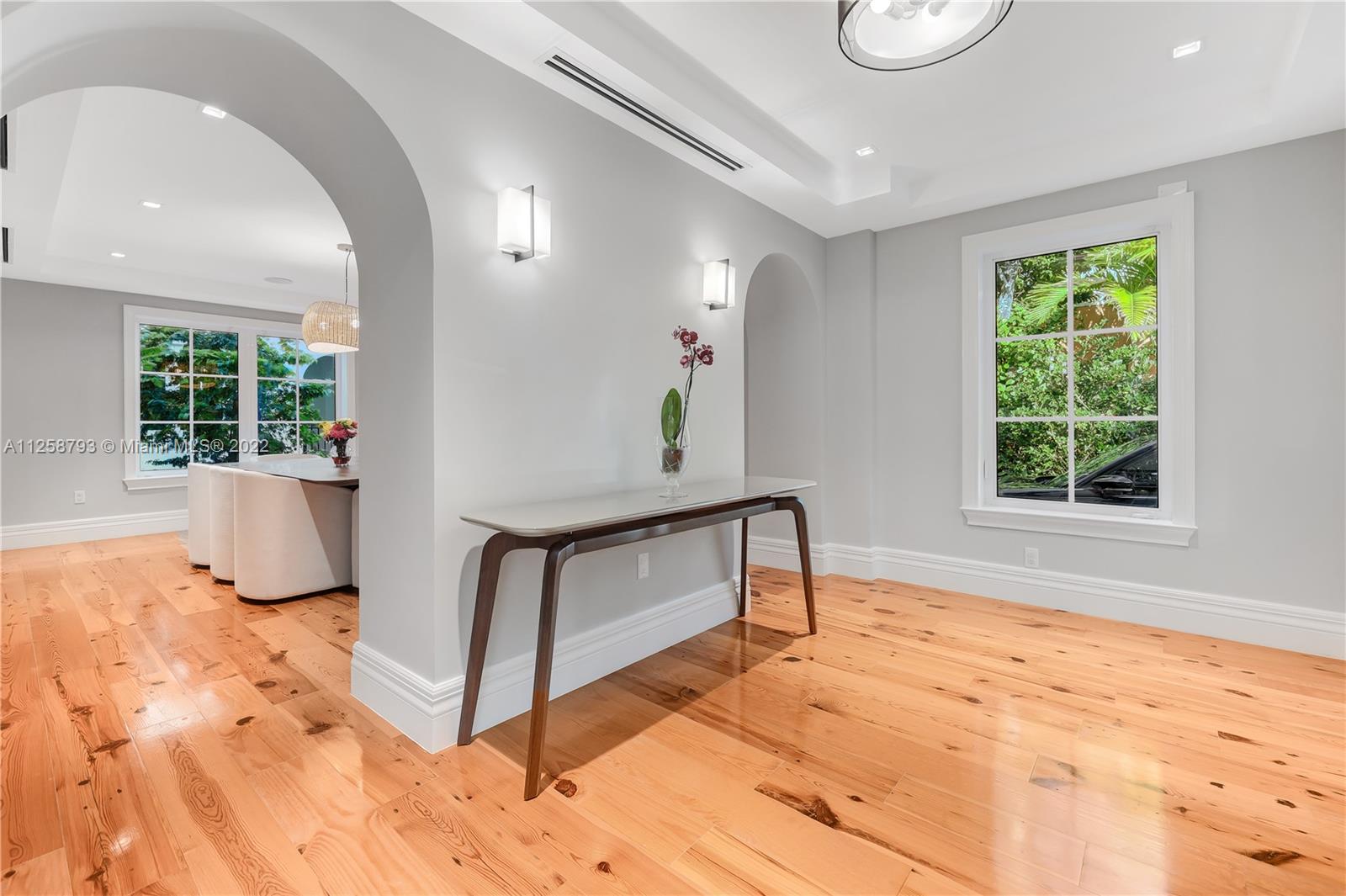 1311 Alhambra Circle Miami, FL 33134 - Photo 12 of 56 a view of an entryway with wooden floor and a rug