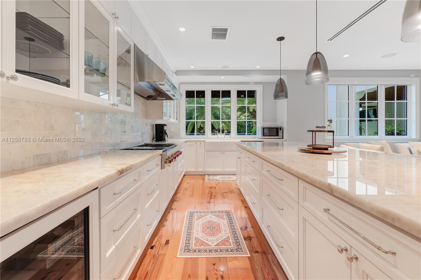 1311 Alhambra Circle Miami, FL 33134 - Photo 16 of 56 a large kitchen with granite countertop a large counter top and potted plant
