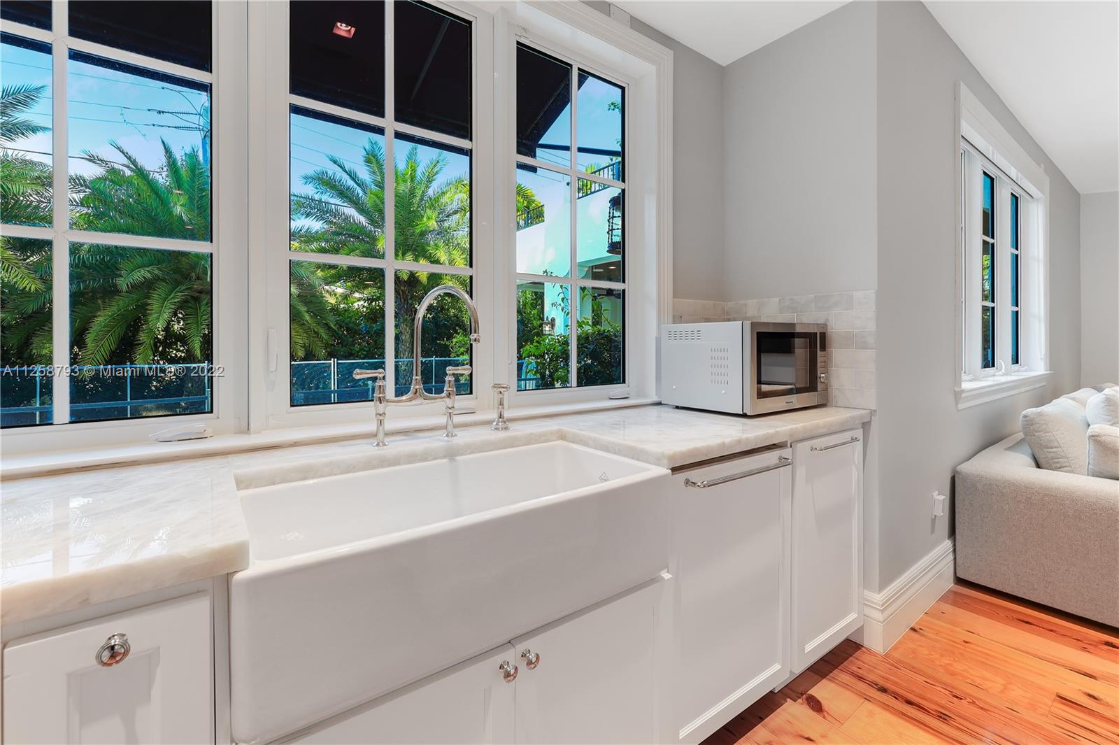 1311 Alhambra Circle Miami, FL 33134 - Photo 18 of 56 a kitchen with a sink and large window