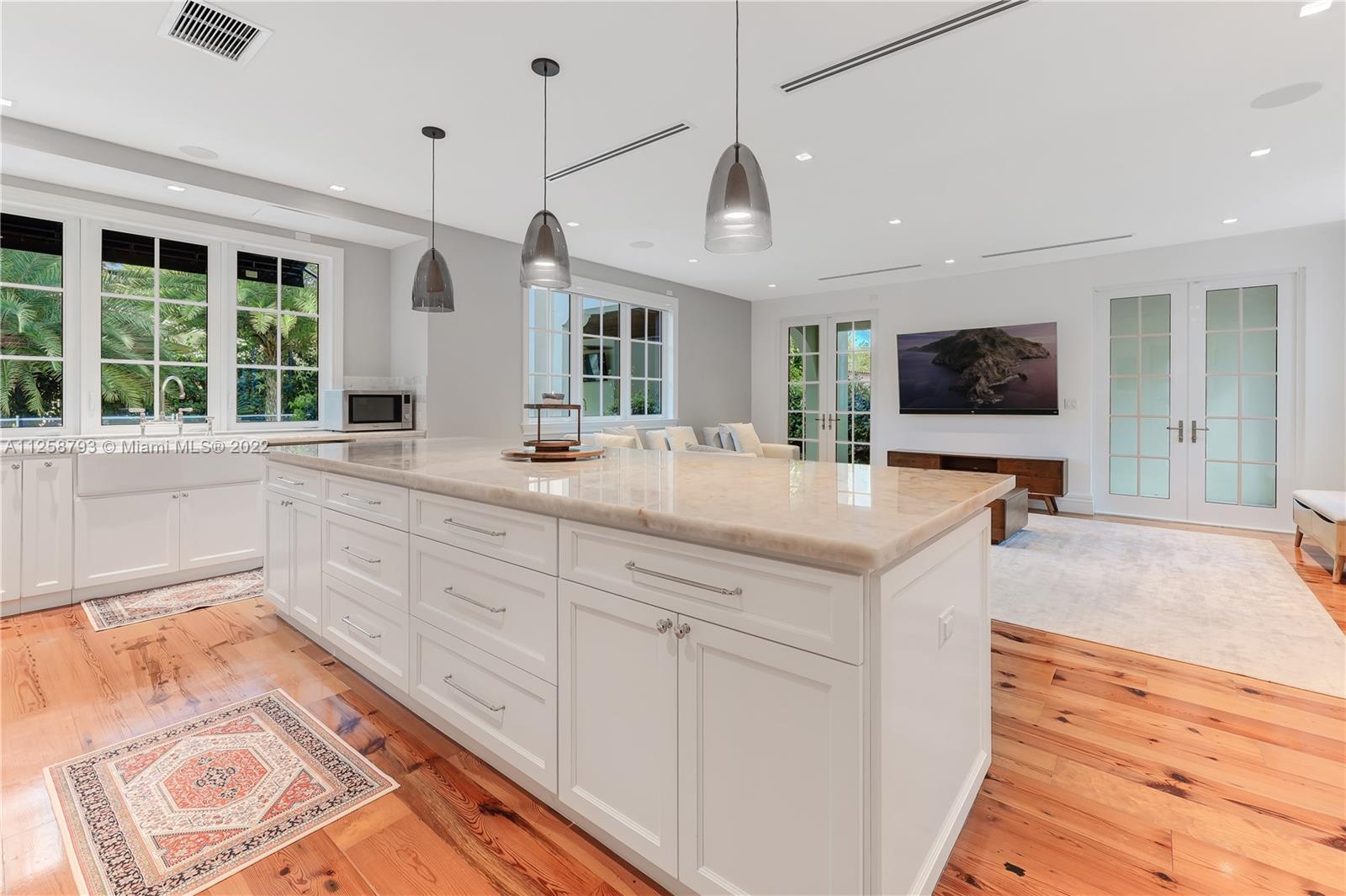 1311 Alhambra Circle Miami, FL 33134 - Photo 20 of 56 a spacious bathroom with sinks mirror and a bathtub