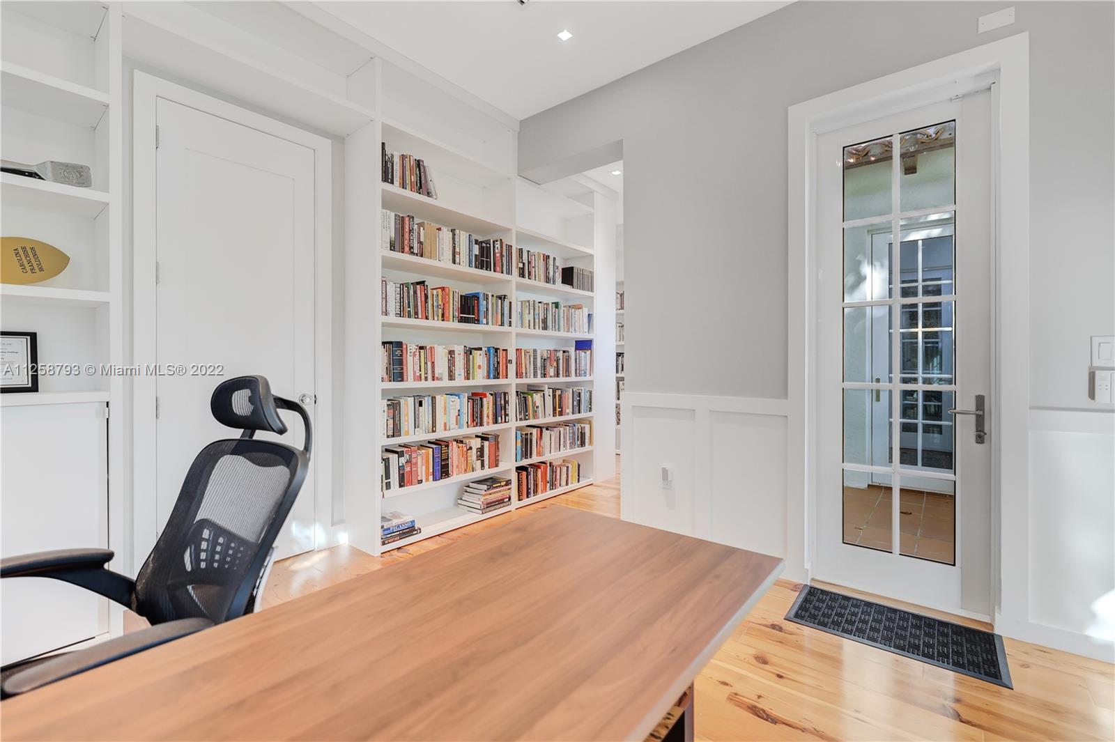 1311 Alhambra Circle Miami, FL 33134 - Photo 24 of 56 a living room with furniture a rug and a window