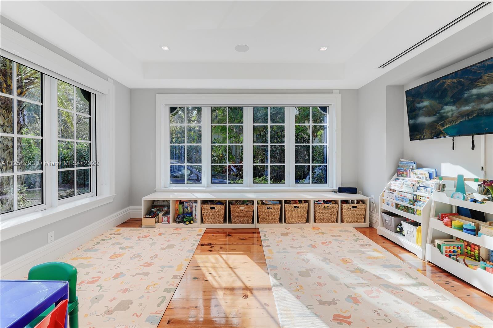 1311 Alhambra Circle Miami, FL 33134 - Photo 25 of 56 a living room filled with furniture and a large window
