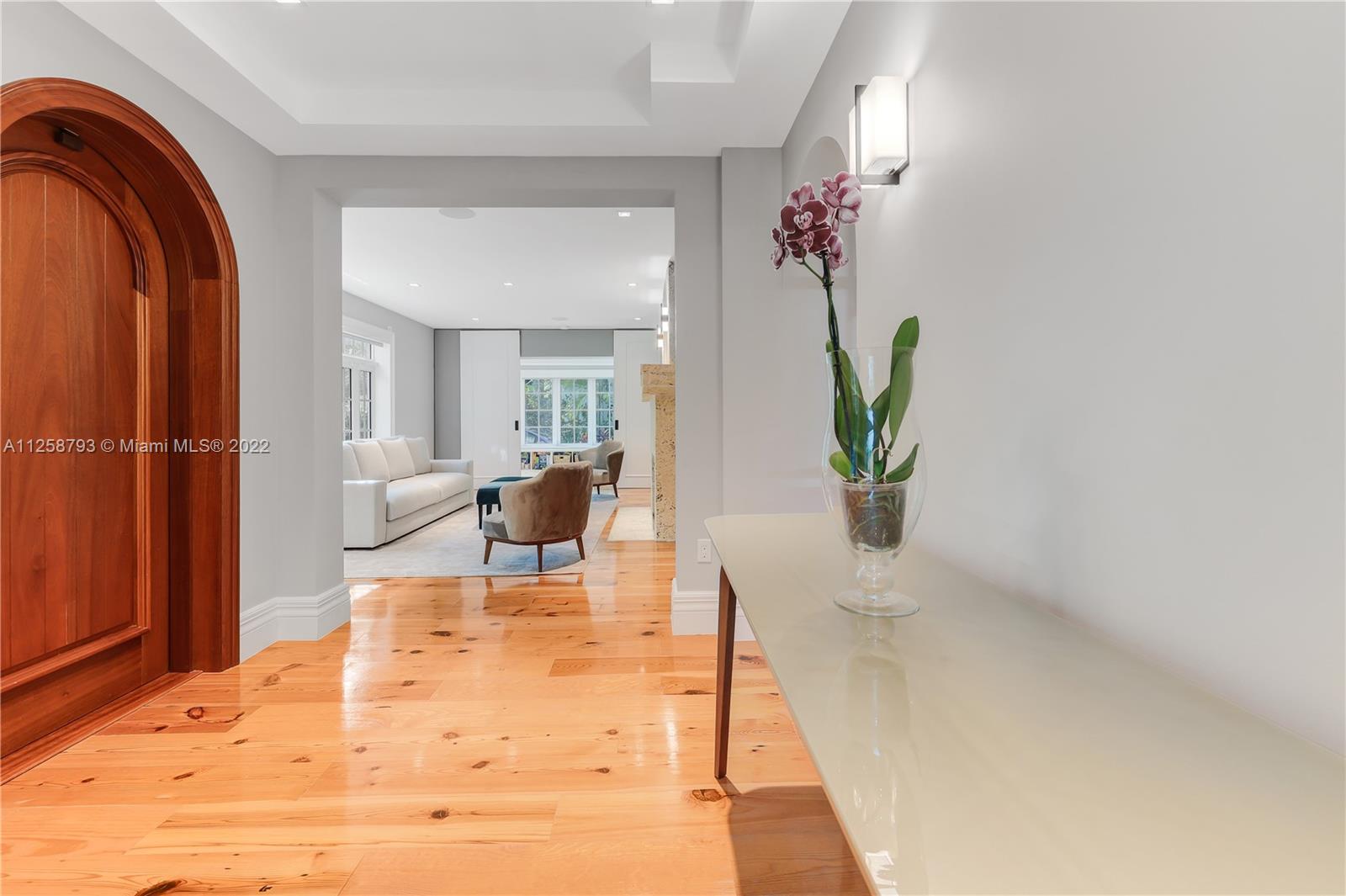 1311 Alhambra Circle Miami, FL 33134 - Photo 29 of 56 a living room with furniture and a potted plant