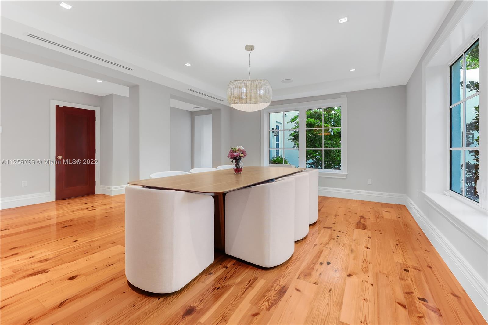 1311 Alhambra Circle Miami, FL 33134 - Photo 30 of 56 a kitchen with kitchen island granite countertop a stove a sink and a wooden floors