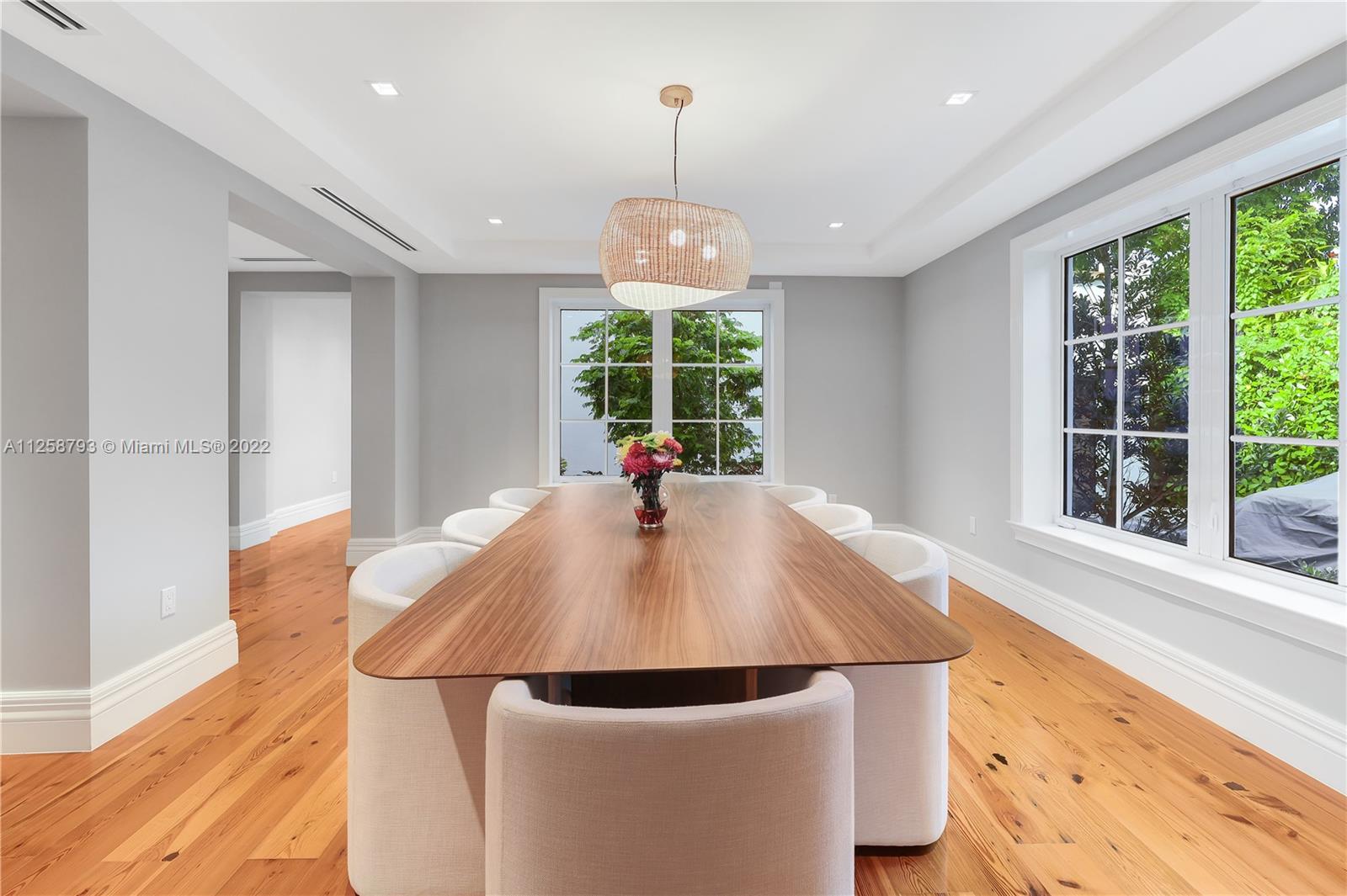 1311 Alhambra Circle Miami, FL 33134 - Photo 31 of 56 a view of a dining room with furniture wooden floor and chandelier
