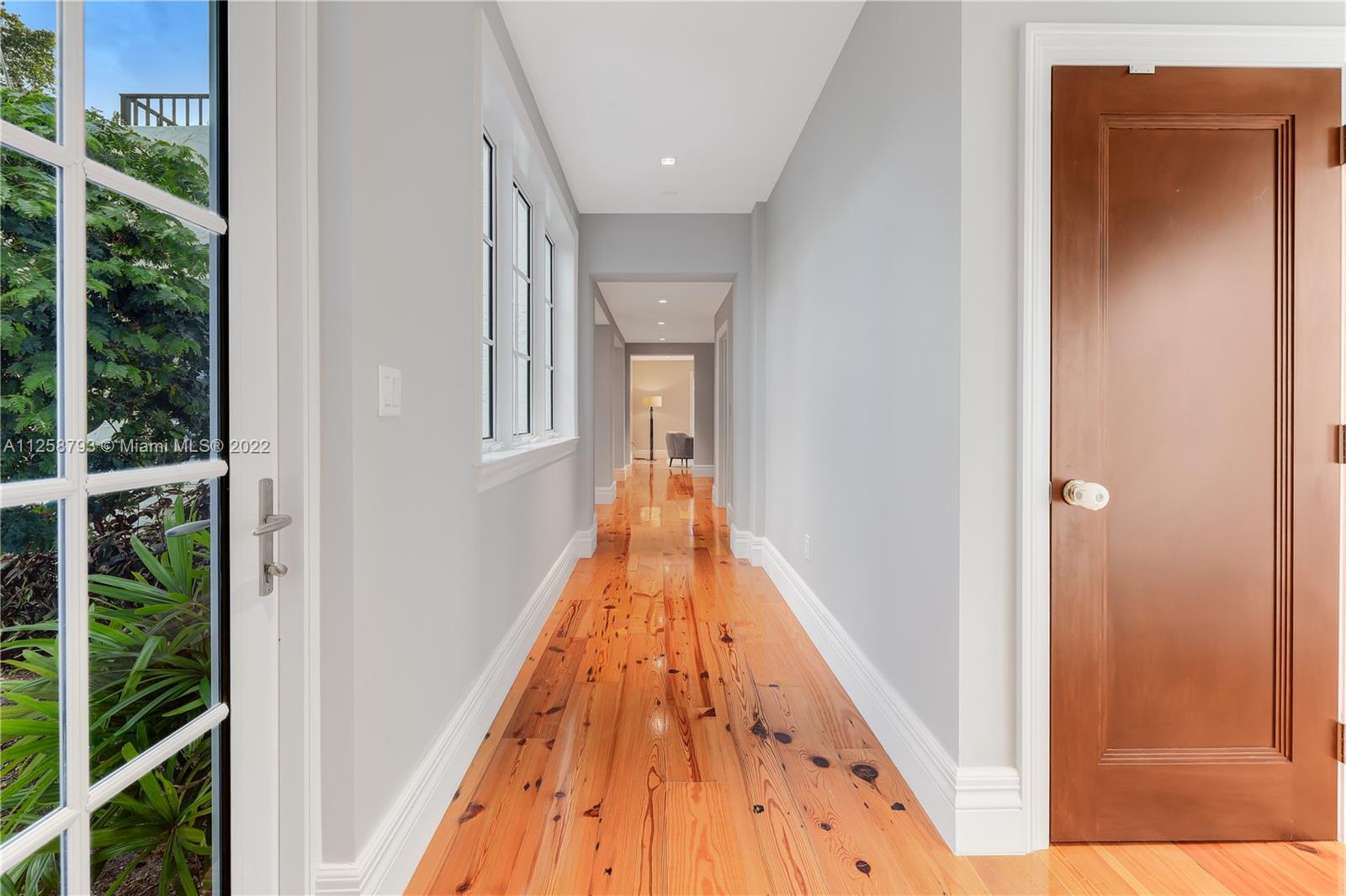 1311 Alhambra Circle Miami, FL 33134 - Photo 33 of 56 a view of a hallway with wooden floor and entryway
