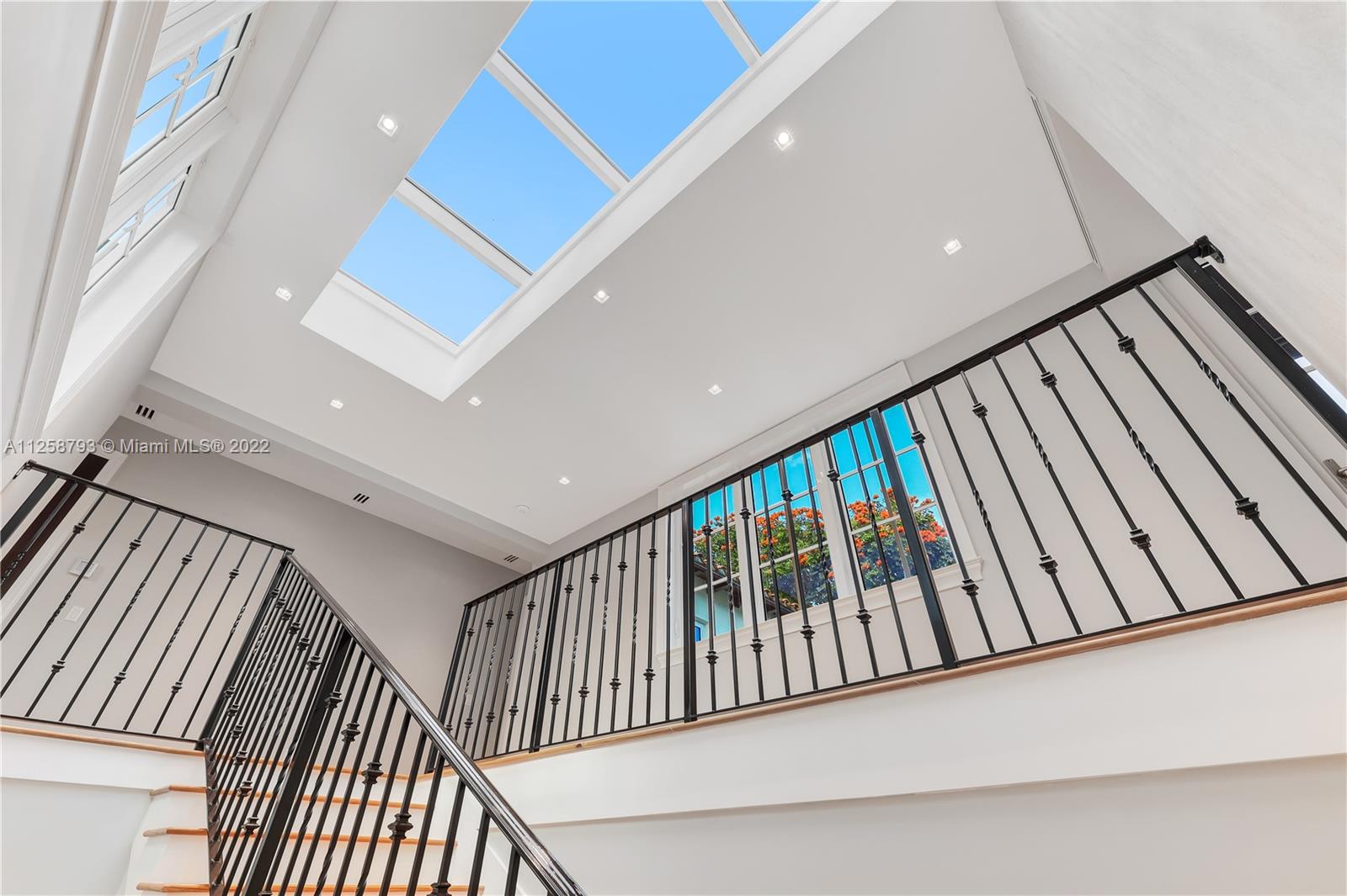 1311 Alhambra Circle Miami, FL 33134 - Photo 34 of 56 a view of staircase with lots of frames on wall