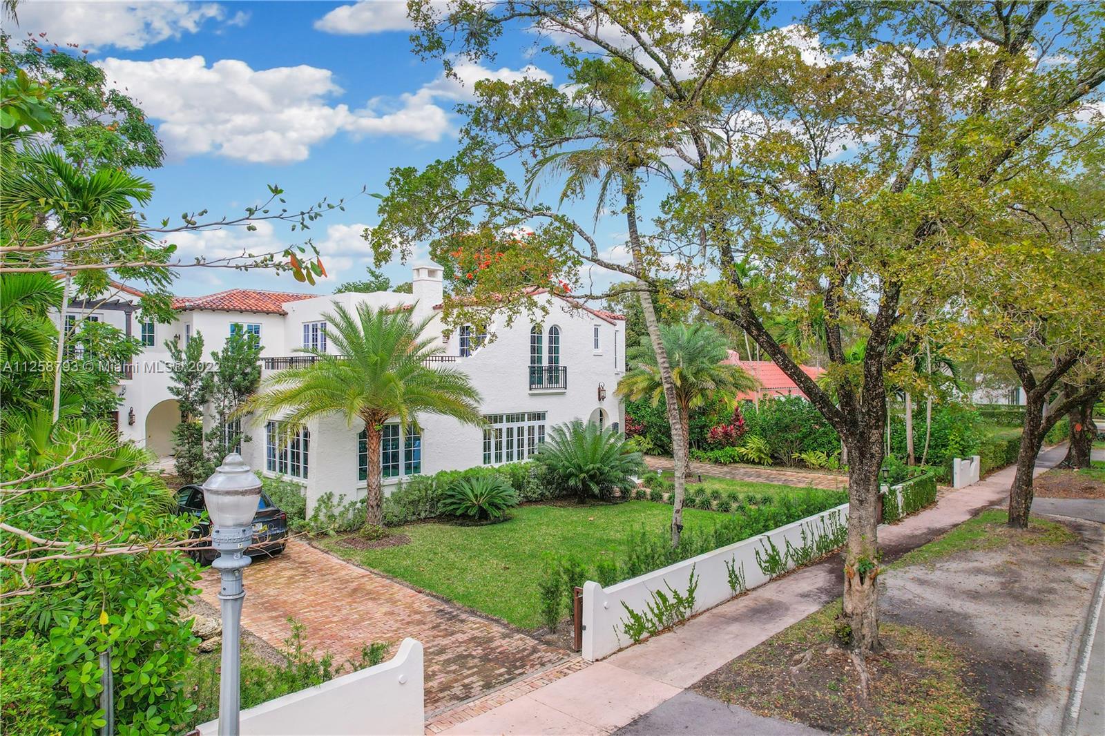 1311 Alhambra Circle Miami, FL 33134 - Photo 38 of 56 a view of a house with a yard and large tree