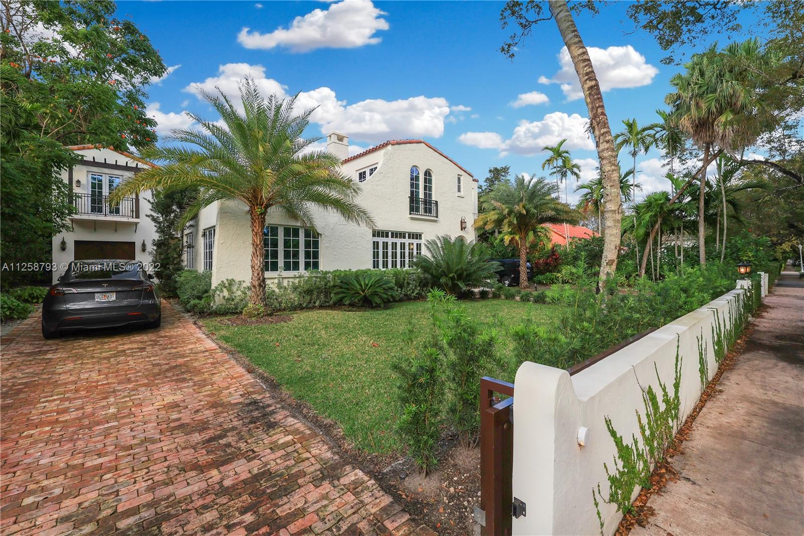 1311 Alhambra Circle Miami, FL 33134 - Photo 4 of 56 a front view of a house with garden