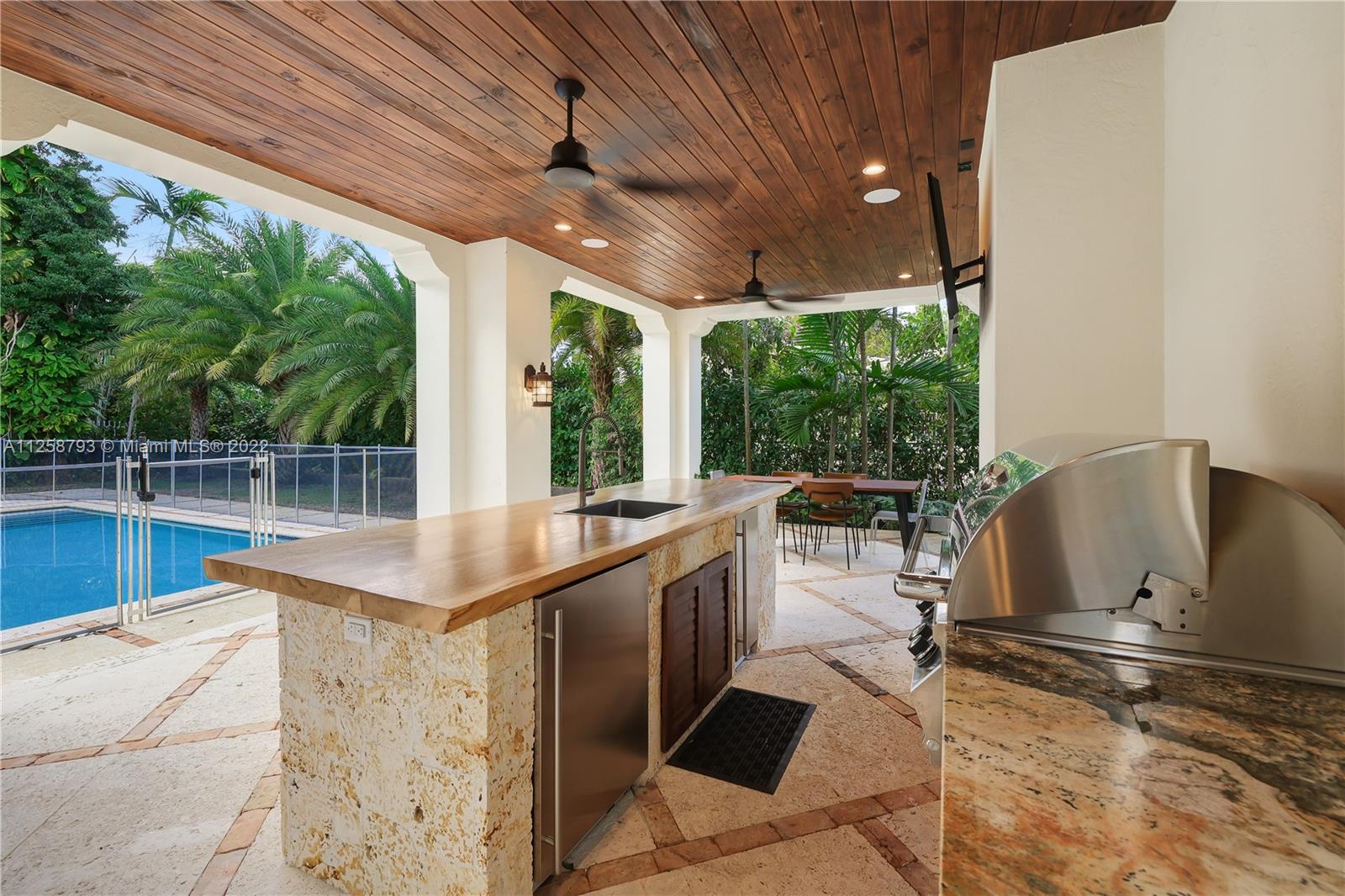 1311 Alhambra Circle Miami, FL 33134 - Photo 45 of 56 a kitchen with a sink and a large window