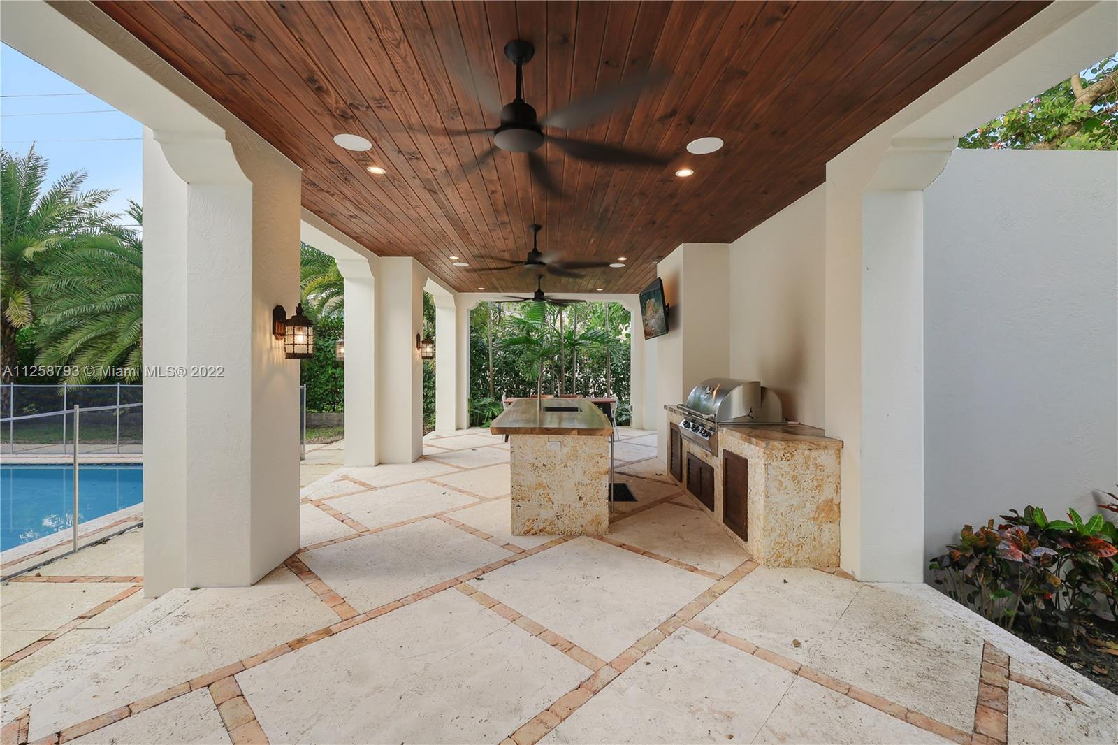 1311 Alhambra Circle Miami, FL 33134 - Photo 46 of 56 a building outdoor space with patio furniture and potted plants