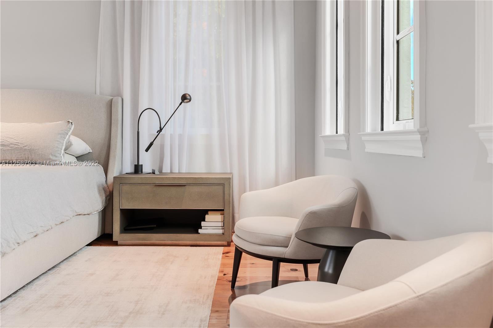 1311 Alhambra Circle Miami, FL 33134 - Photo 47 of 56 a bedroom with a bed and a chair