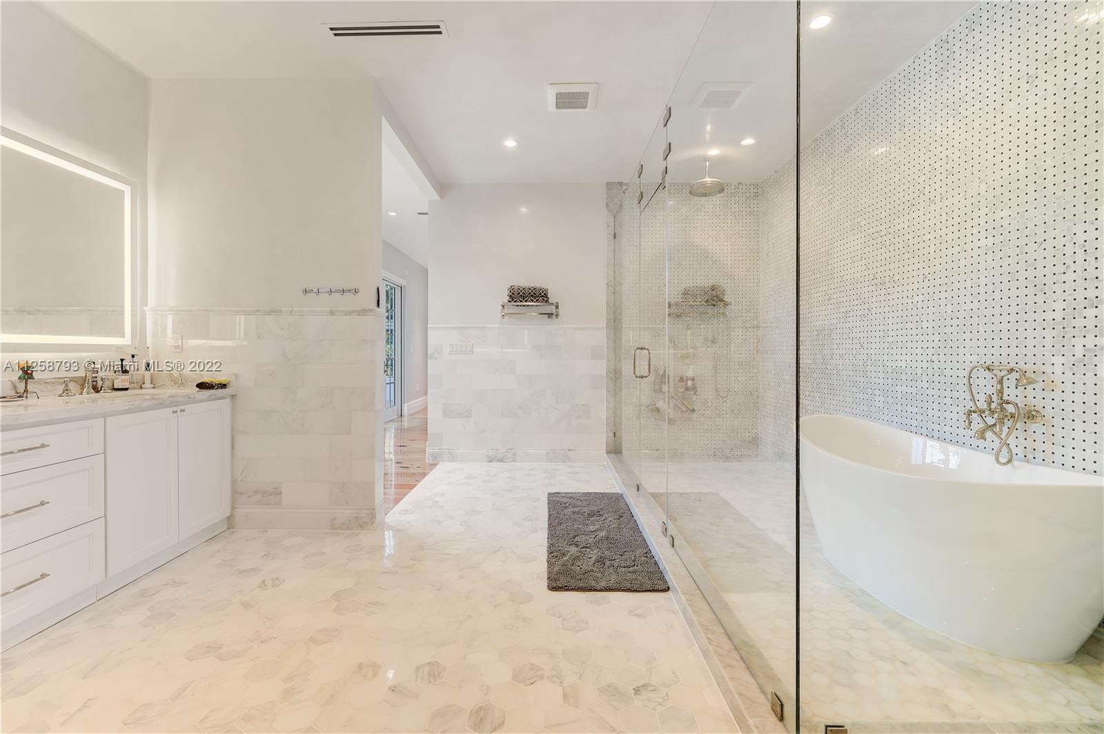 1311 Alhambra Circle Miami, FL 33134 - Photo 55 of 56 a bathroom with a bathtub shower sink and toilet