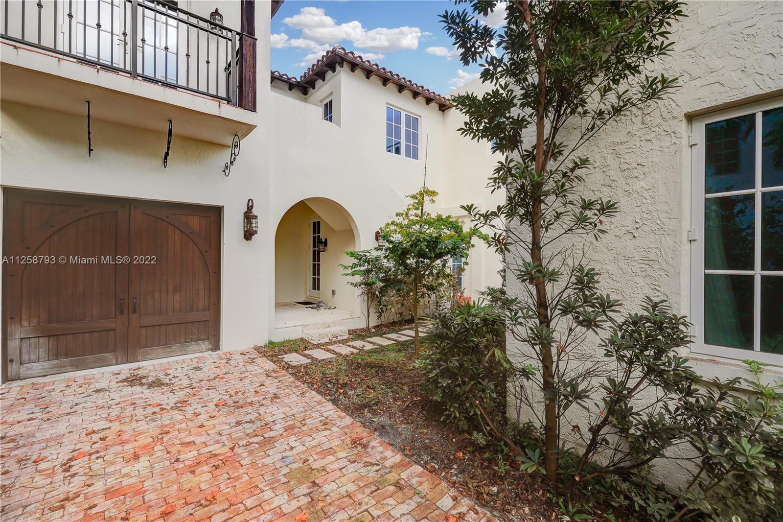 1311 Alhambra Circle Miami, FL 33134 - Photo 7 of 56 a view of a house with a yard