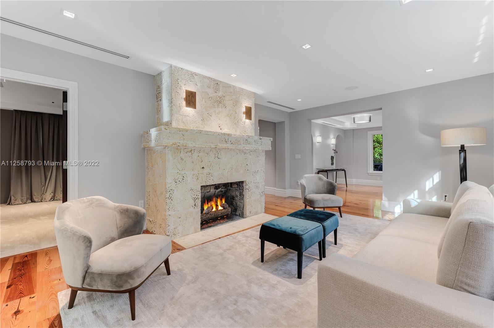 1311 Alhambra Circle Miami, FL 33134 - Photo 8 of 56 a living room with furniture and a fireplace