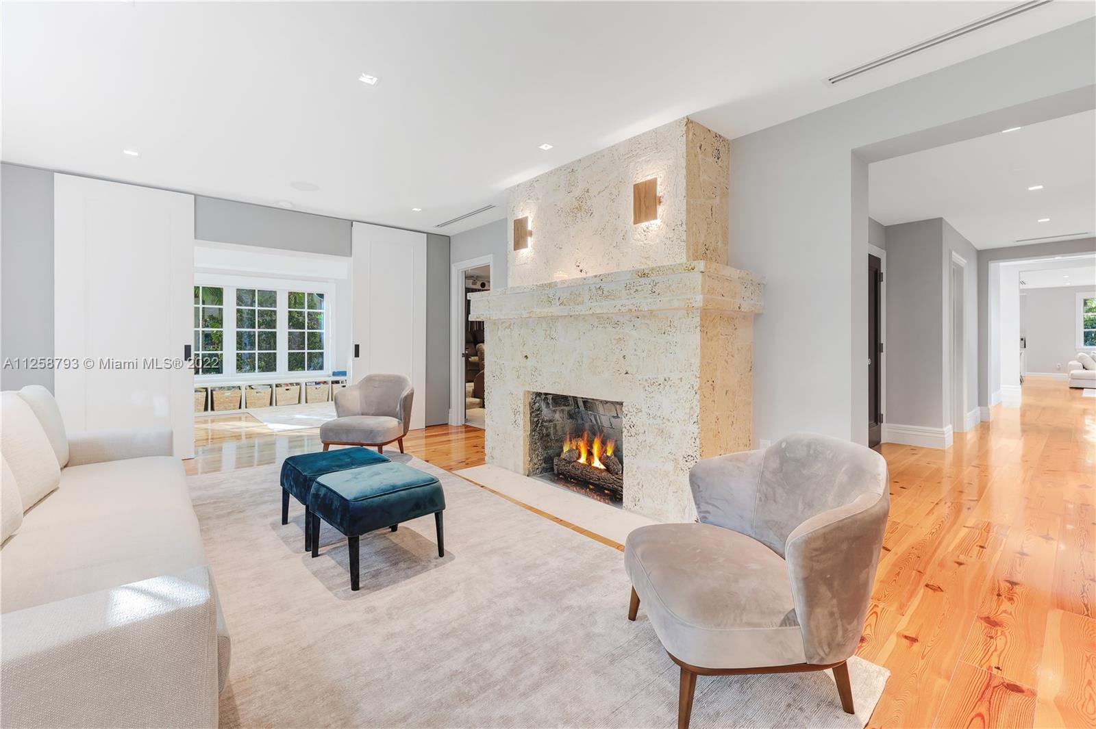 1311 Alhambra Circle Miami, FL 33134 - Photo 10 of 56 a living room with furniture and a fireplace