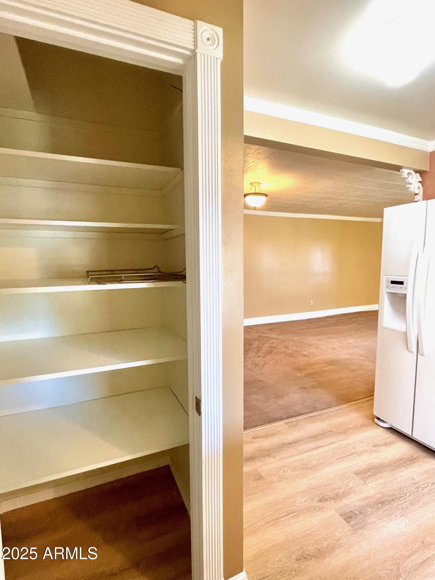 220 A Opera Drive Bisbee, AZ 85603 - Photo 18 of 46 a view of walk in closet with empty racks