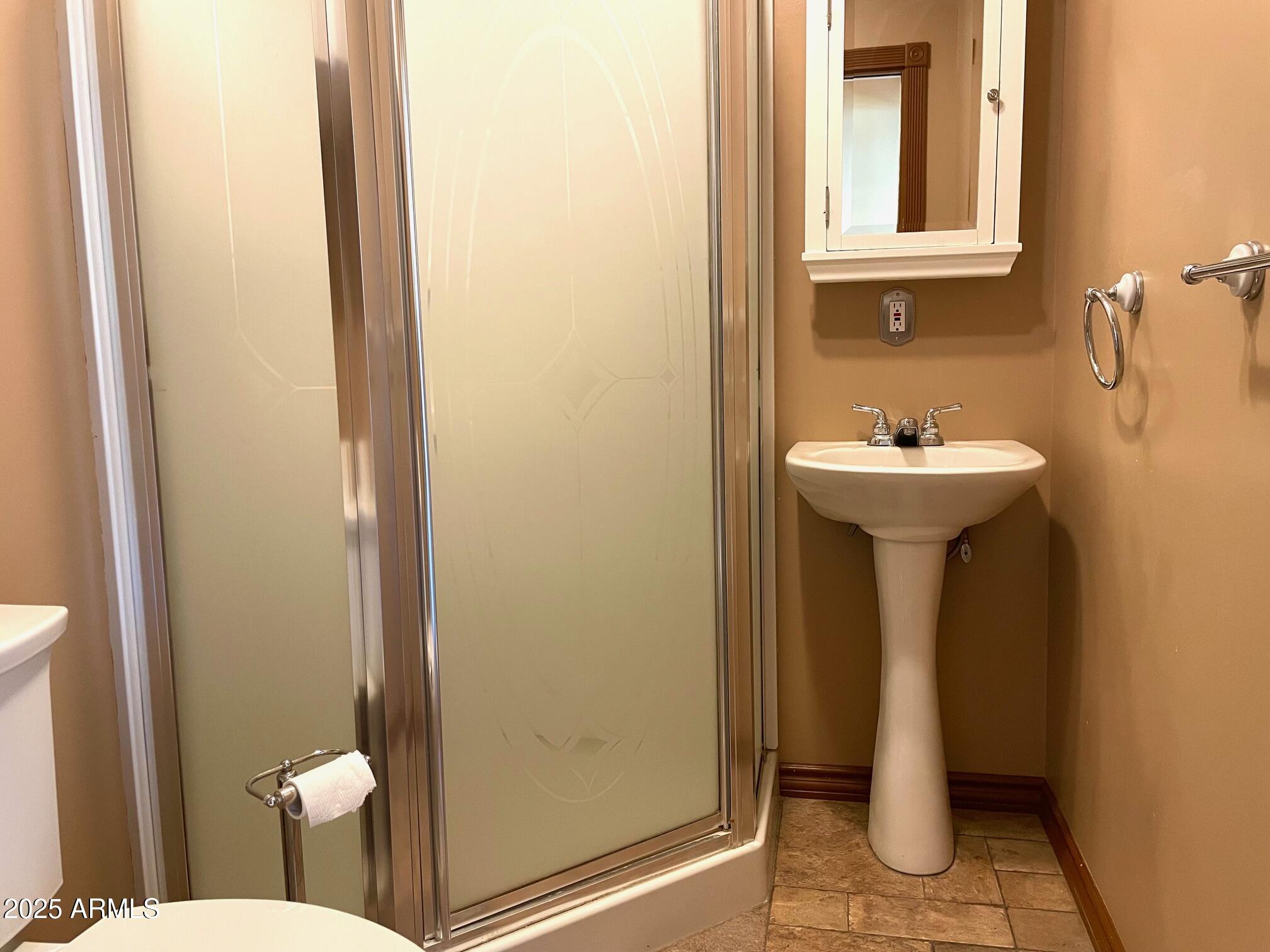 220 A Opera Drive Bisbee, AZ 85603 - Photo 19 of 46 a bathroom with a sink and mirror