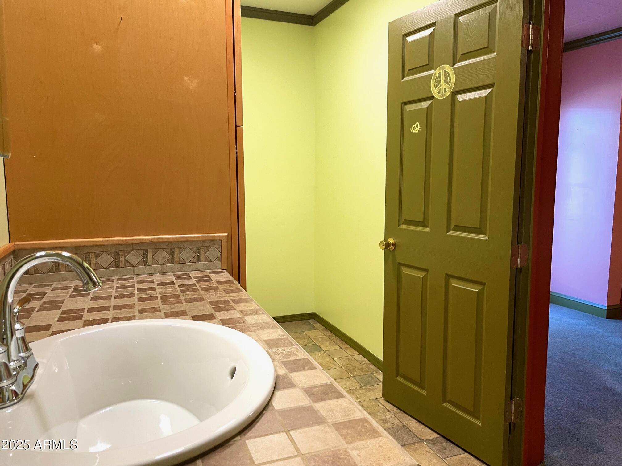 220 A Opera Drive Bisbee, AZ 85603 - Photo 28 of 46 a bathroom with a tub and shower