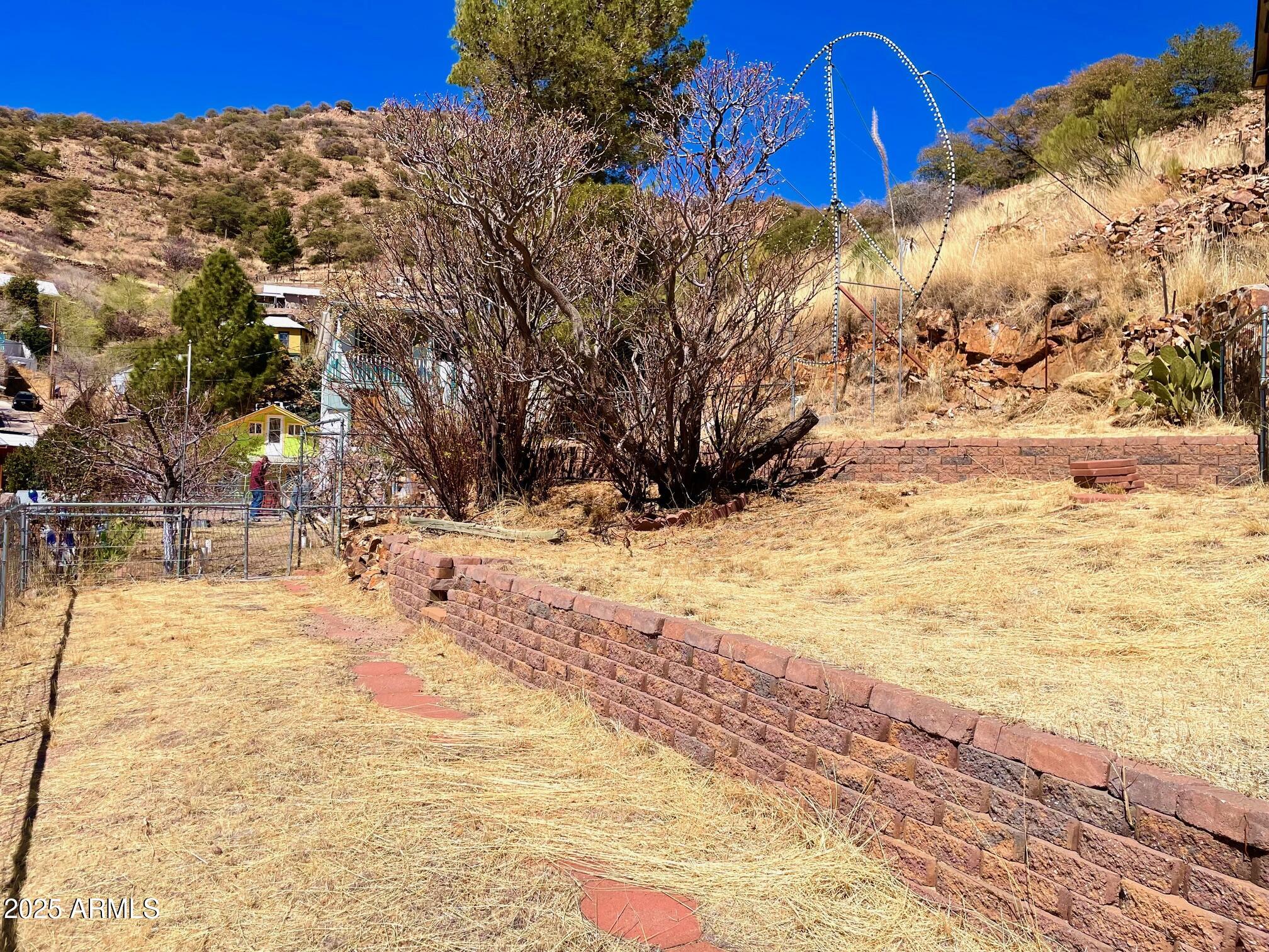 220 A Opera Drive Bisbee, AZ 85603 - Photo 37 of 46 a view of yard covered with snow in the background