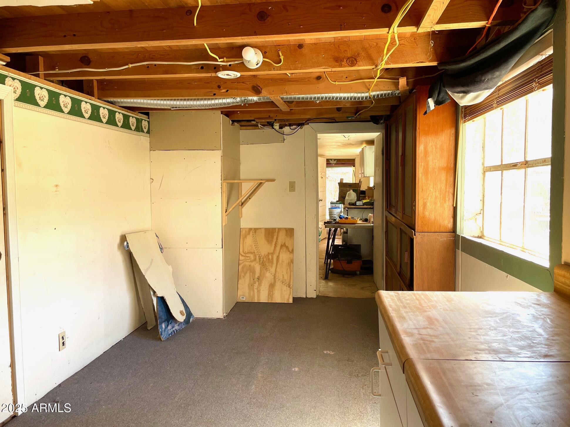 220 A Opera Drive Bisbee, AZ 85603 - Photo 45 of 46 a view of a hallway with wooden floor and a glass door