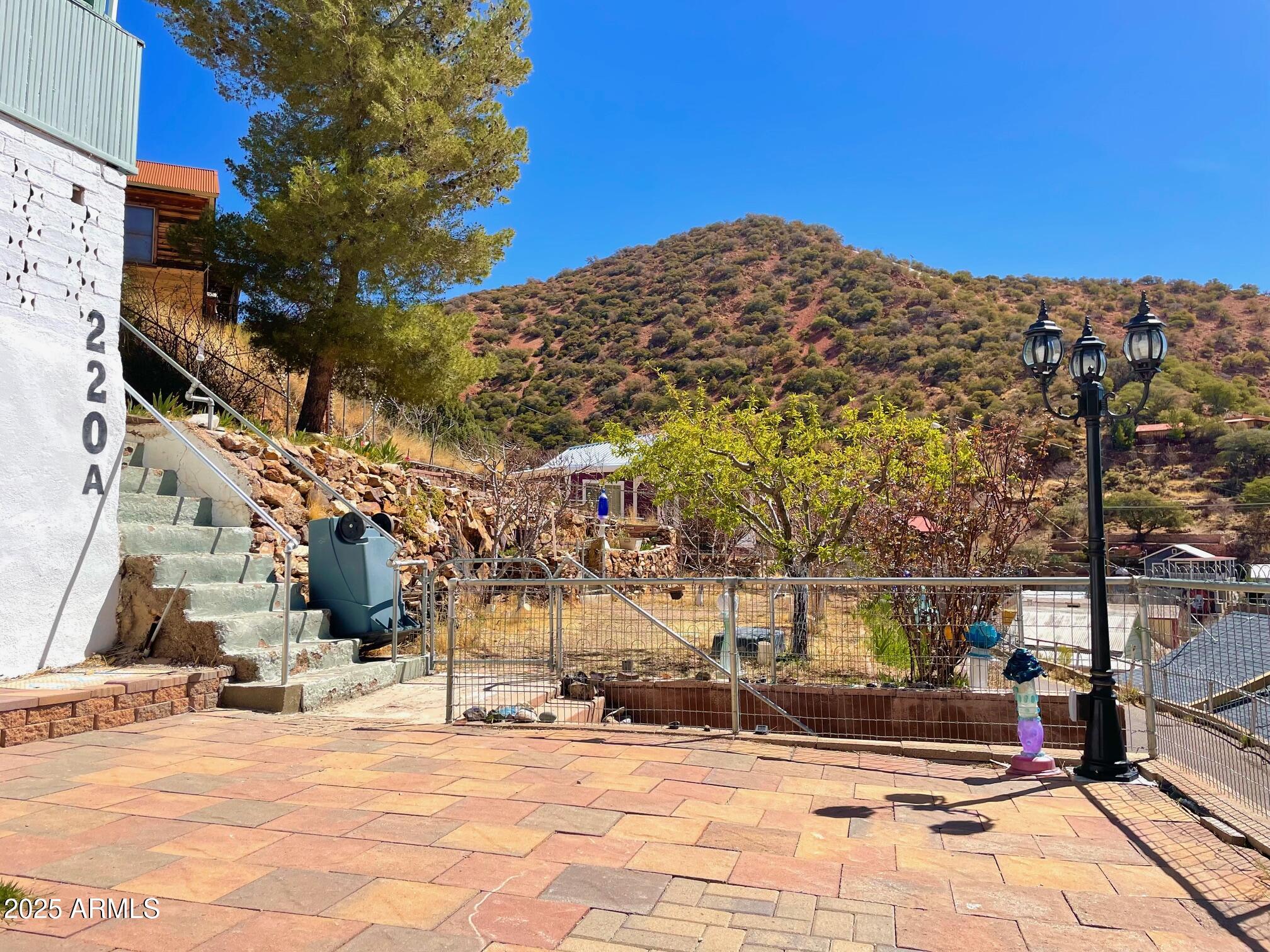 220 A Opera Drive Bisbee, AZ 85603 - Photo 7 of 46 a view of a building with many windows
