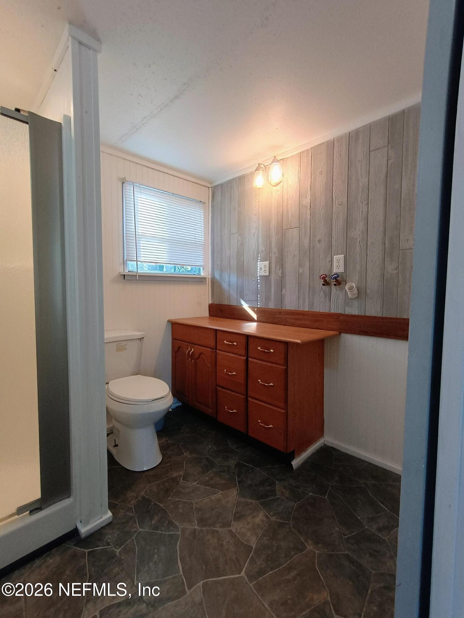 215 Pine Tree Trail Crescent City, FL 32112 - Photo 16 of 25 a room with a sink and a toilet