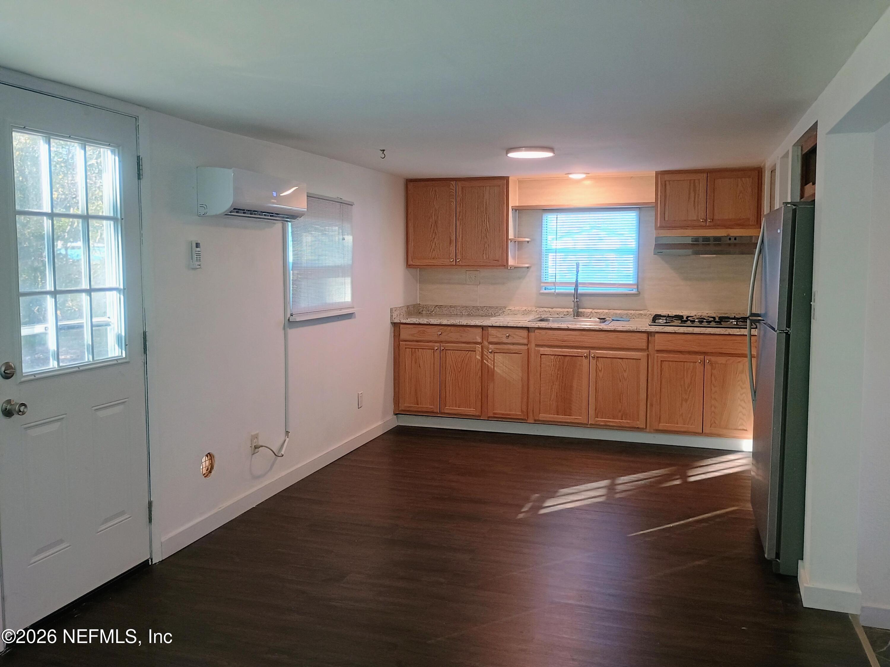 215 Pine Tree Trail Crescent City, FL 32112 - Photo 19 of 25 a kitchen with granite countertop a stove and a refrigerator