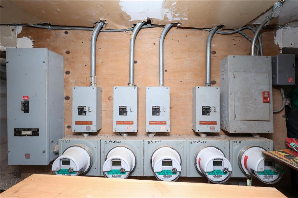 5813 4th Avenue Brooklyn, NY 11220 - Photo 15 of 25 a view of walk in closet with clothes and shoes
