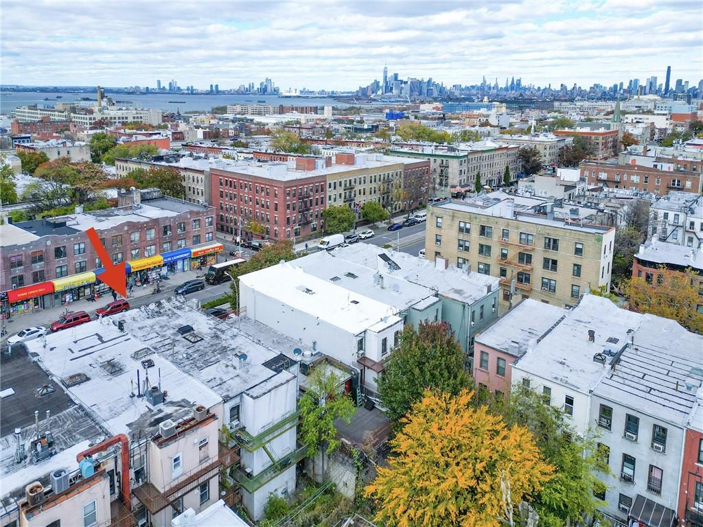 5813 4th Avenue Brooklyn, NY 11220 - Photo 24 of 25 an aerial view of a city with lots of residential buildings