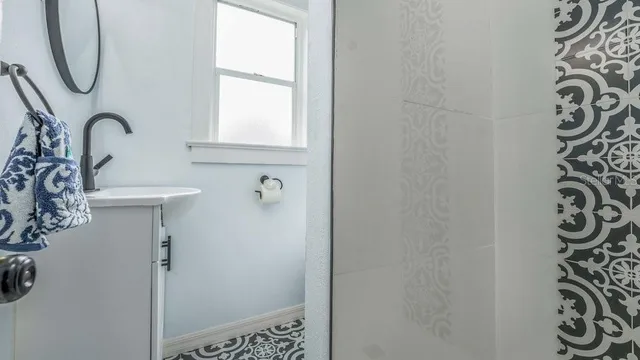 a bathroom with a sink and a mirror