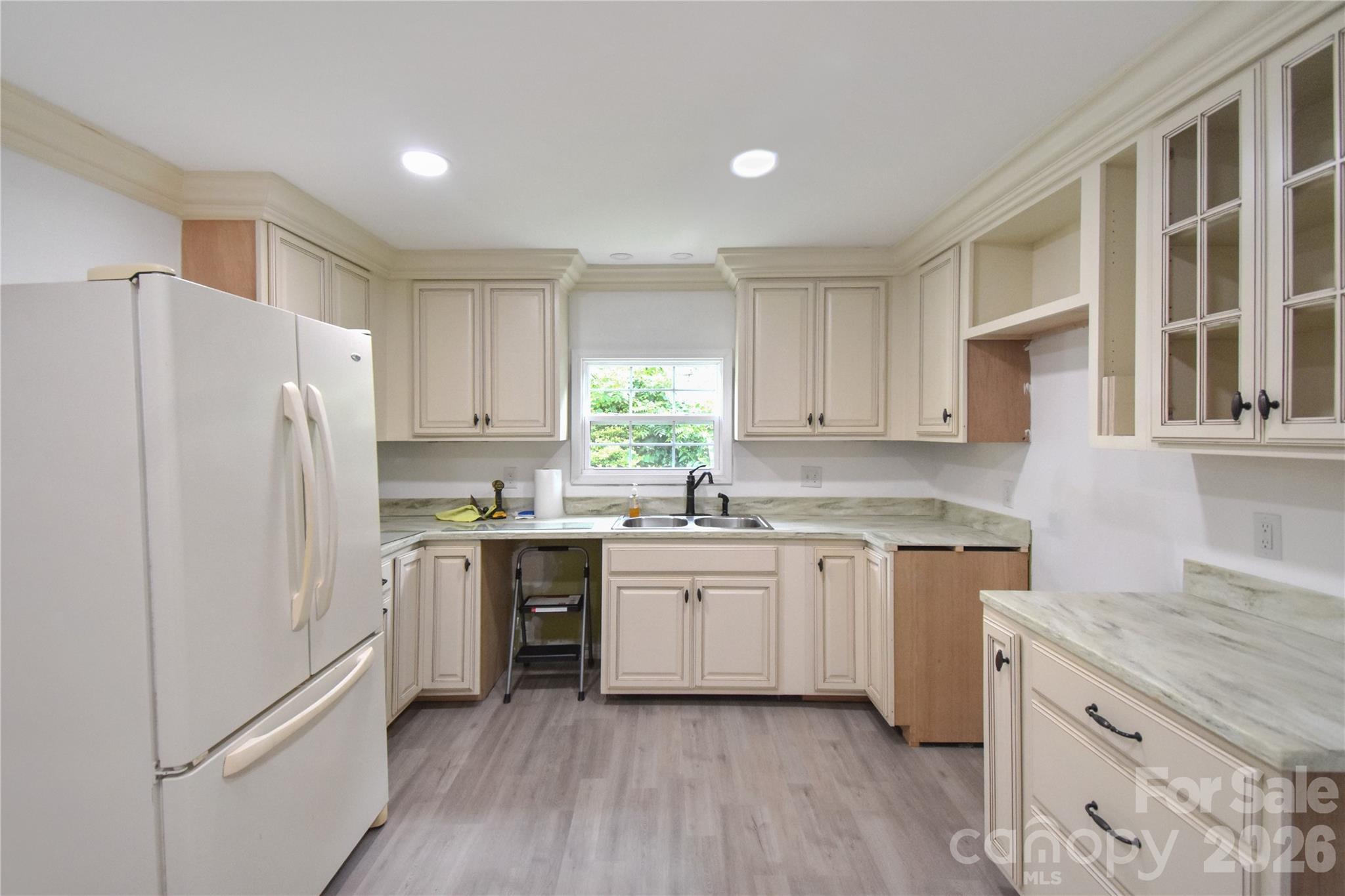 622 Green St Loop Marion, NC 28752 - Photo 3 of 16 a kitchen with granite countertop appliances cabinets and a sink