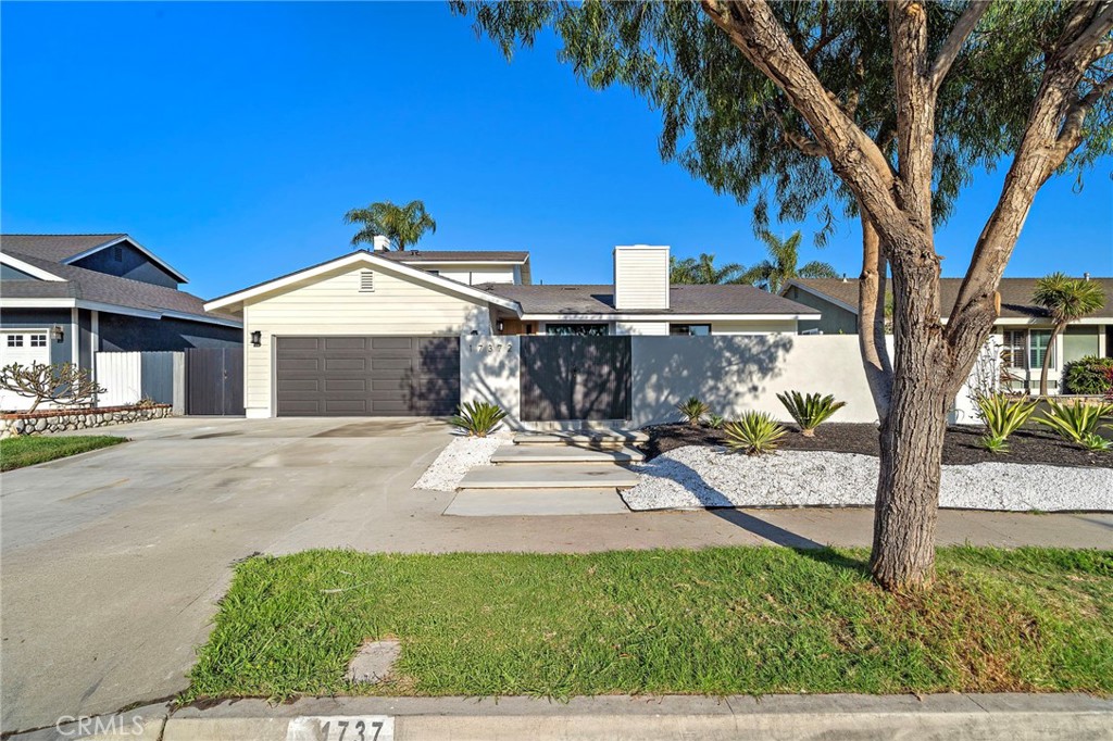 17372 Forbes Lane Huntington Beach, CA 92649 - Photo 1 of 1 a view of a house with a yard and tree s
