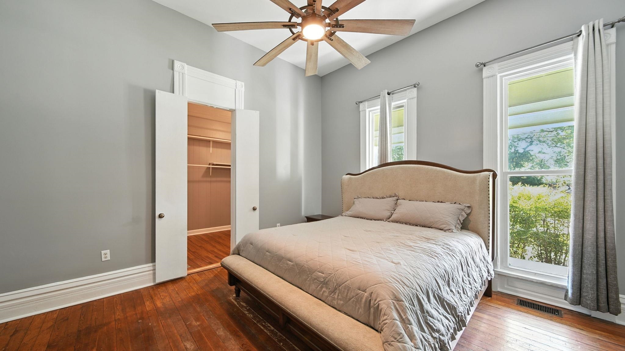 320 North Maple Street Covington, TN 38019 - Photo 11 of 35 Bedroom with hardwood / wood-style flooring, a ceiling fan, and a closet