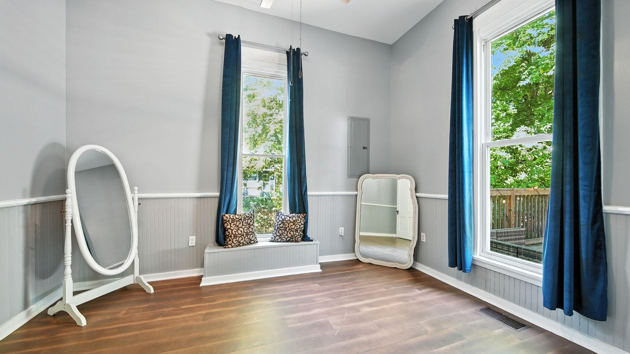 320 North Maple Street Covington, TN 38019 - Photo 25 of 35 Unfurnished room featuring a wainscoted wall, wood finished floors, and electric panel