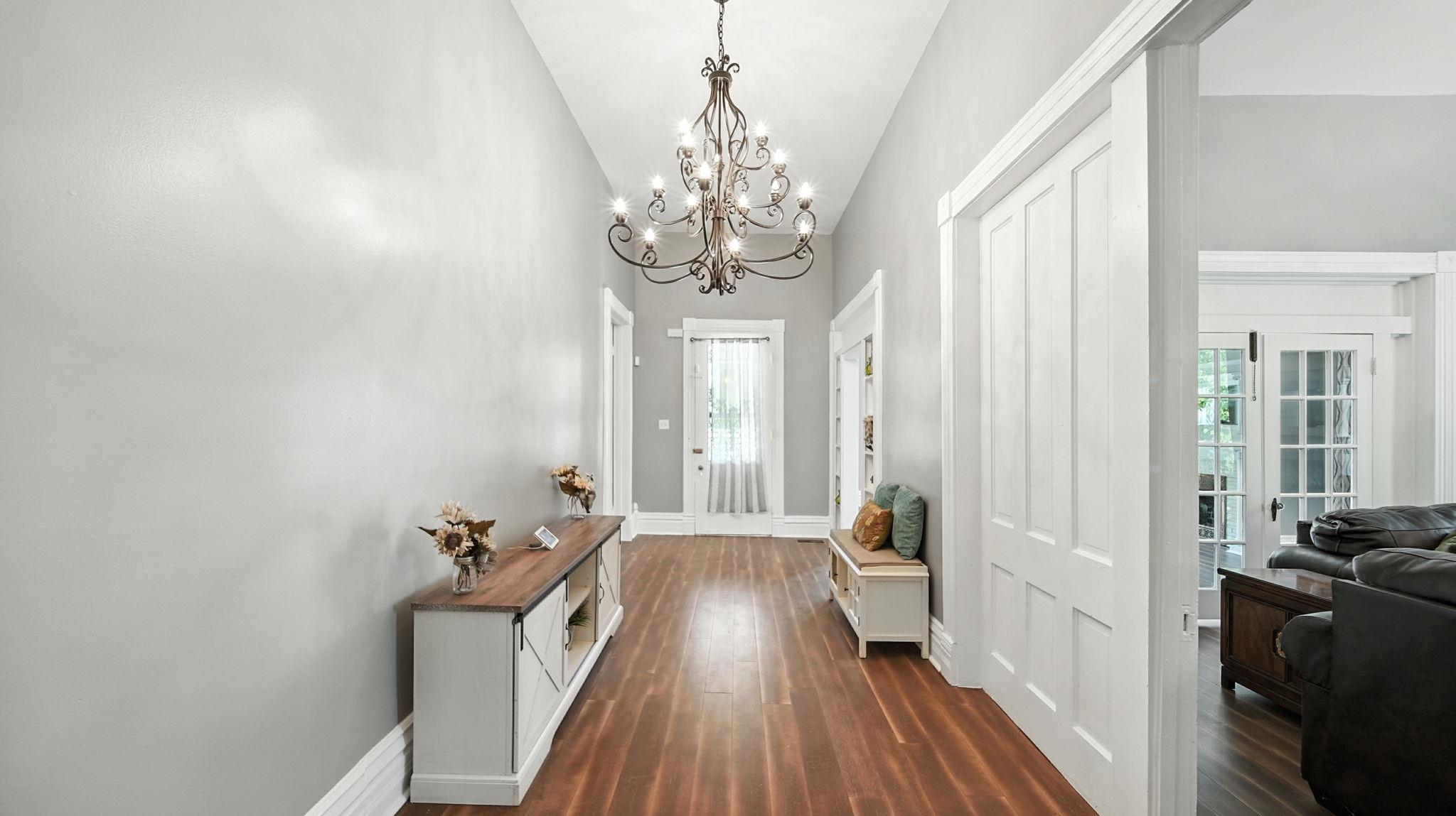 320 North Maple Street Covington, TN 38019 - Photo 7 of 35 Doorway with wood finished floors and a chandelier