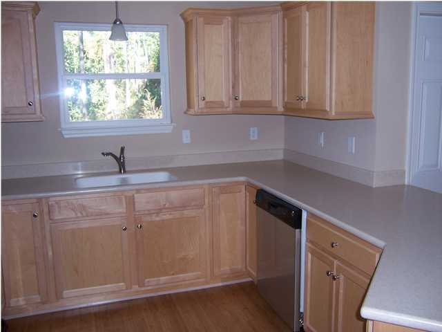 610 Churchill Bayou Road Santa Rosa Beach, FL 32459 - Photo 3 of 7 a kitchen with a sink cabinets and window