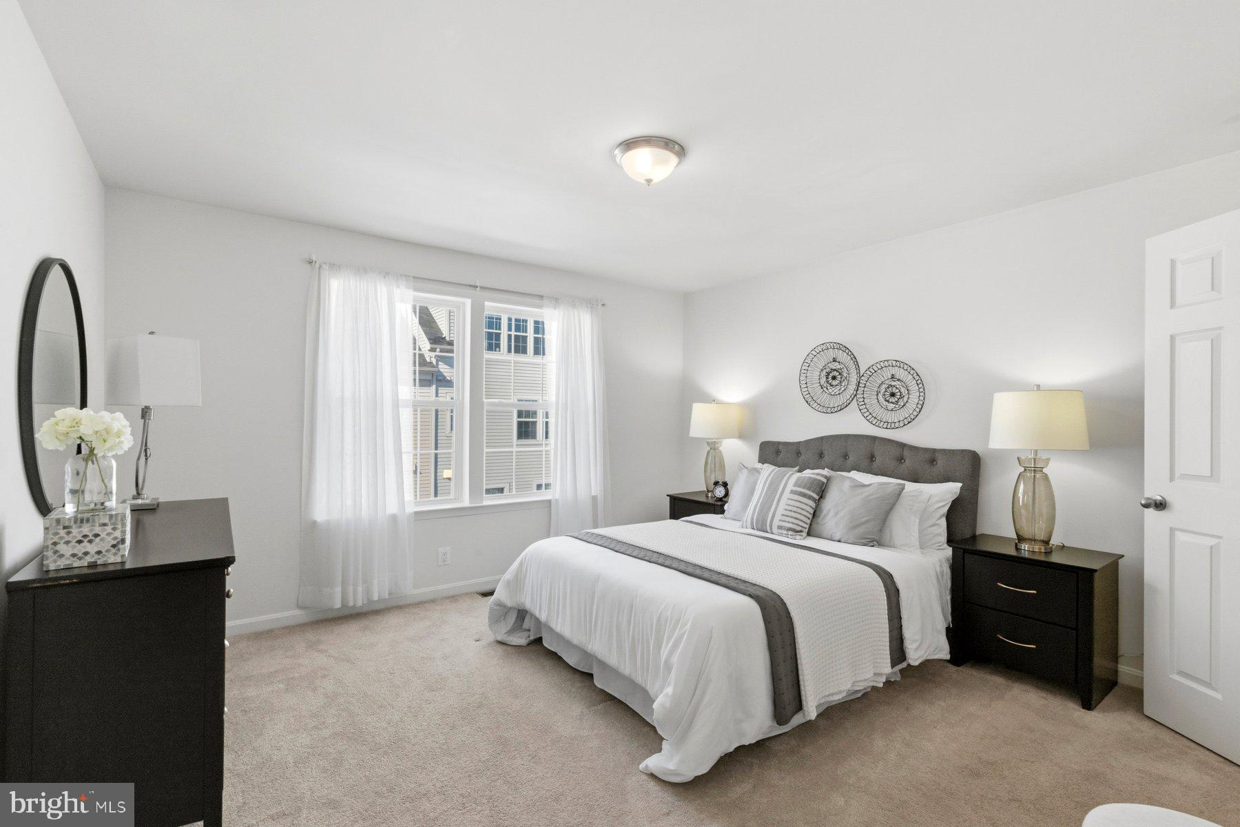 7205 Barry Lane Elkridge, MD 21075 - Photo 12 of 22 a bedroom with a bed and a window