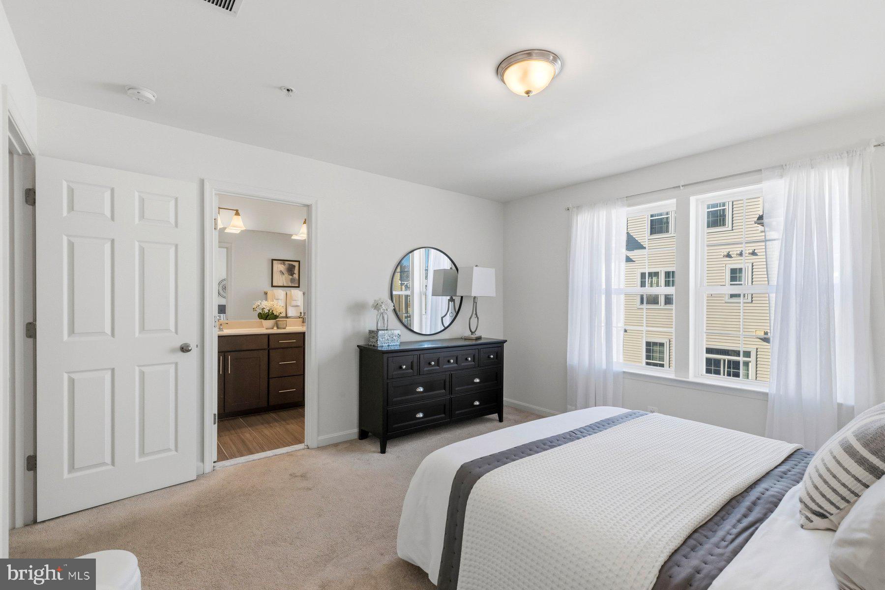 7205 Barry Lane Elkridge, MD 21075 - Photo 13 of 22 a bedroom with a bed and a window